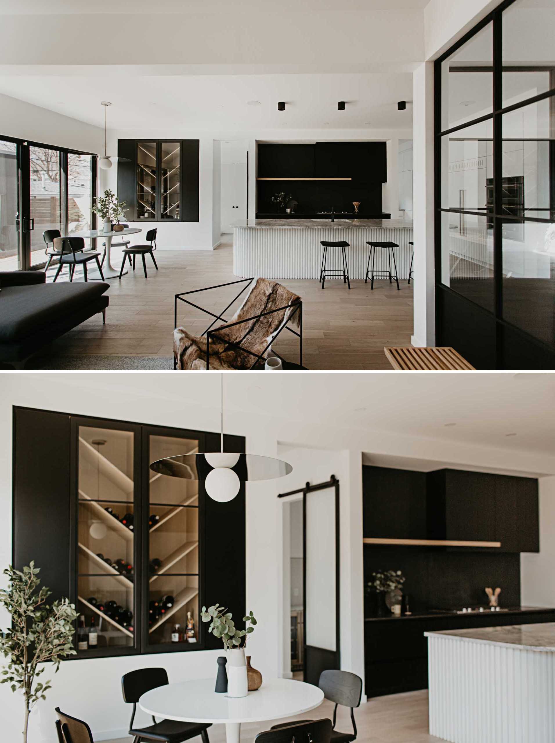 A wine rack with shelves angled in a chevron pattern creates an interesting focal point to this dining area, while a round table is positioned below the minimalist pendant light.