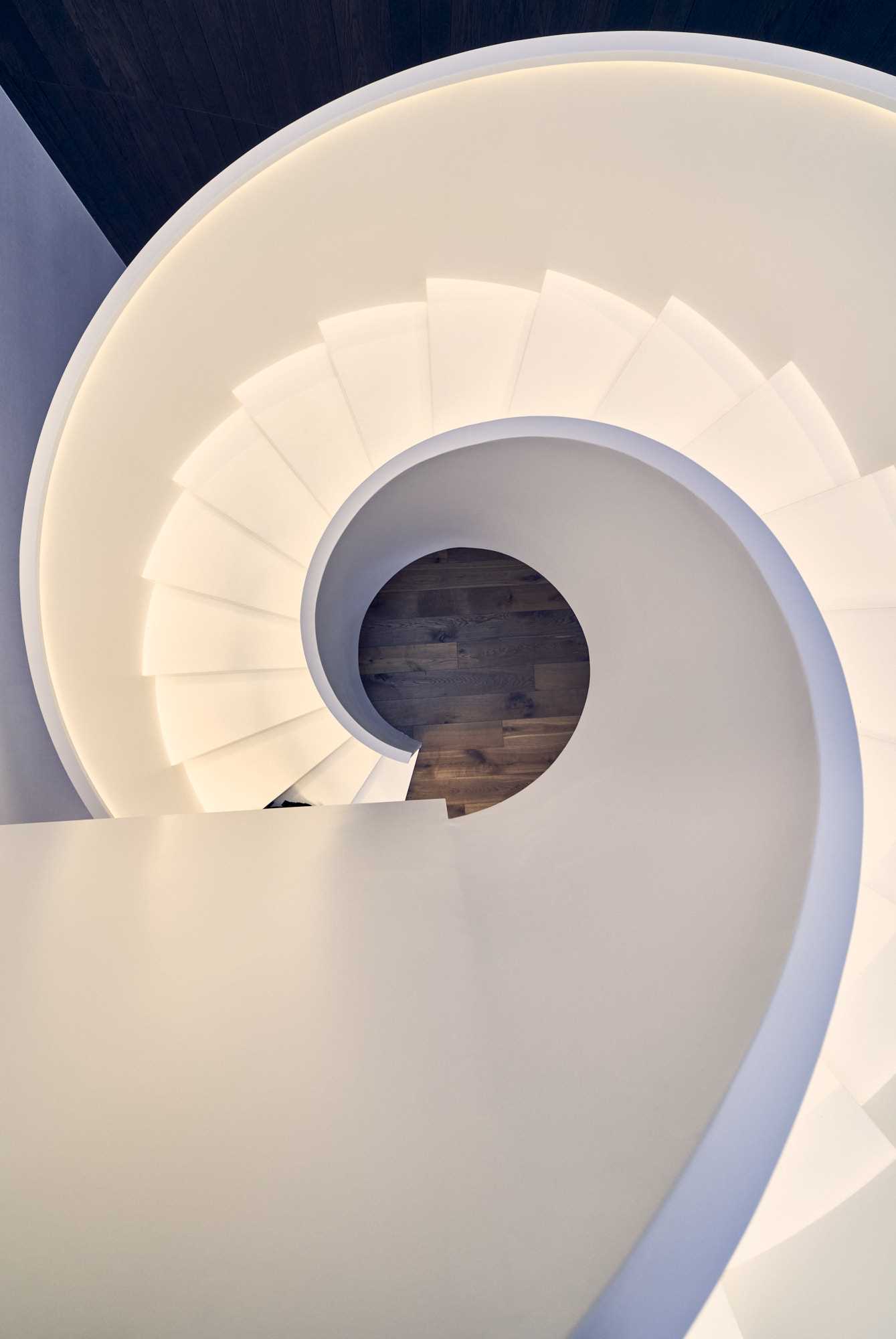 Sculptural white spiral staircase.