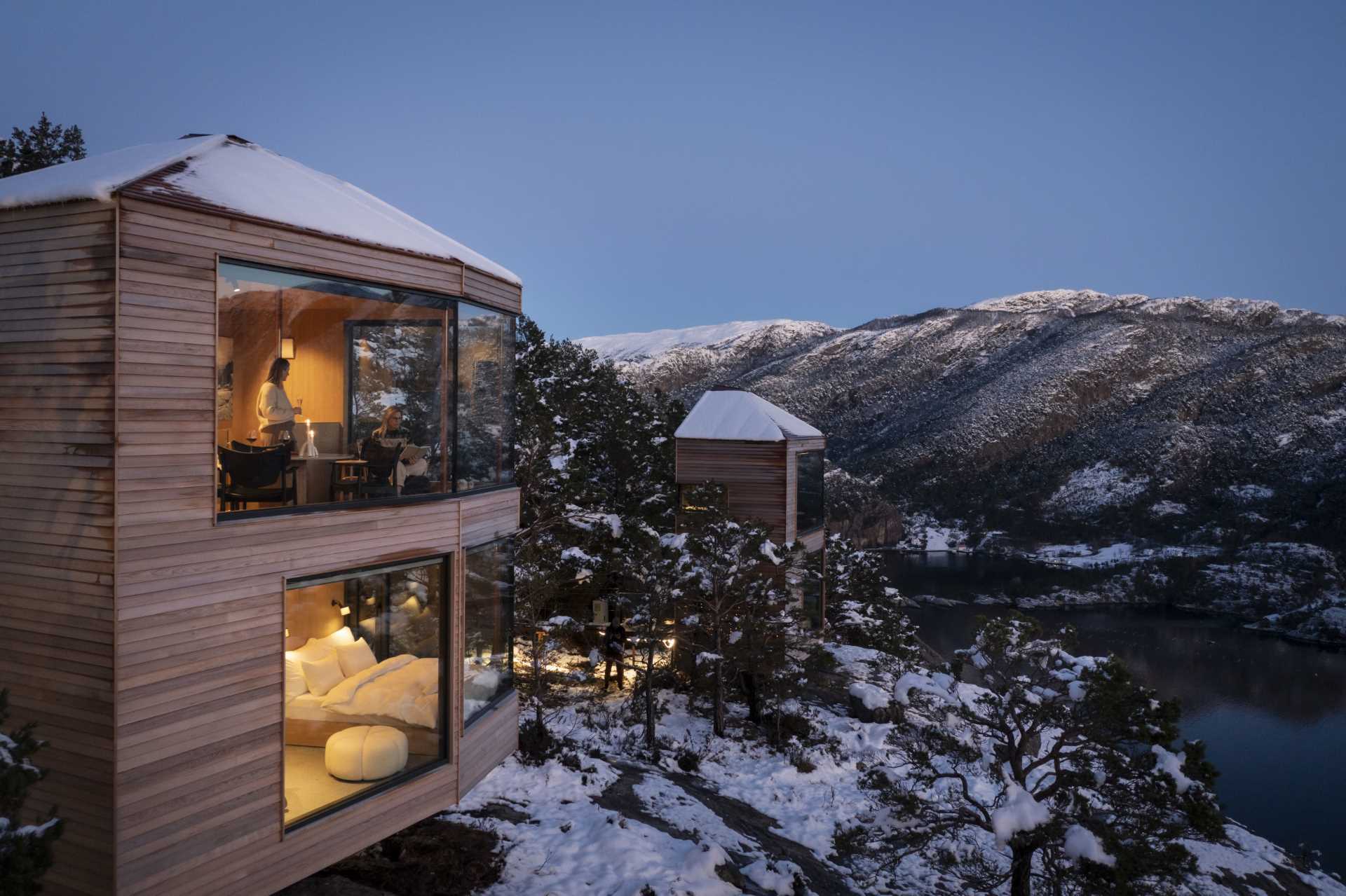 Modern cabins that have been built to blend in with the landscape with a minimal footprint on the surrounding nature.