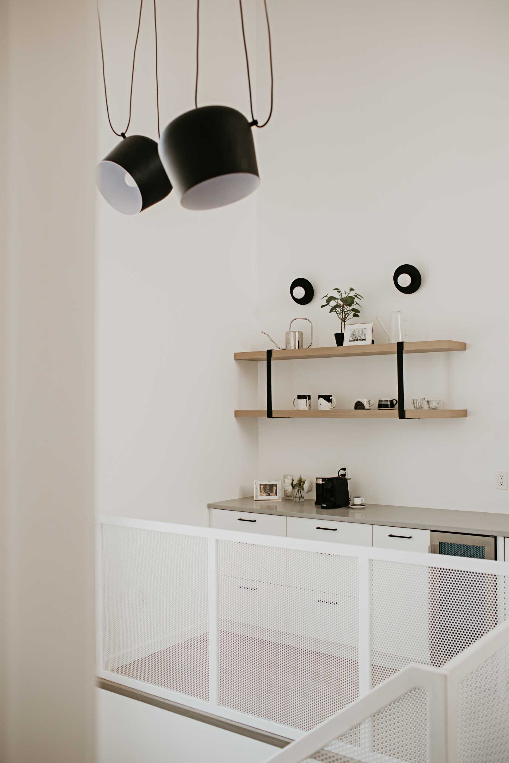 A home with a bar area that acts as a coffee station.