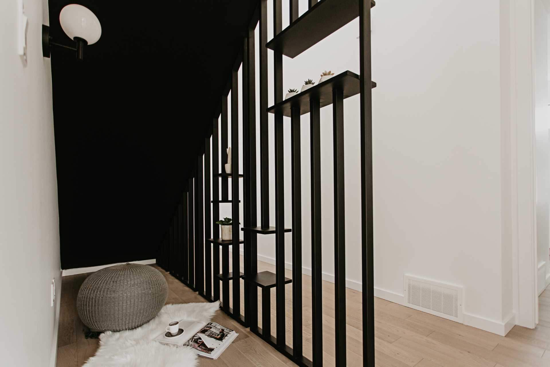 A small reading nook located underneath the stairs.