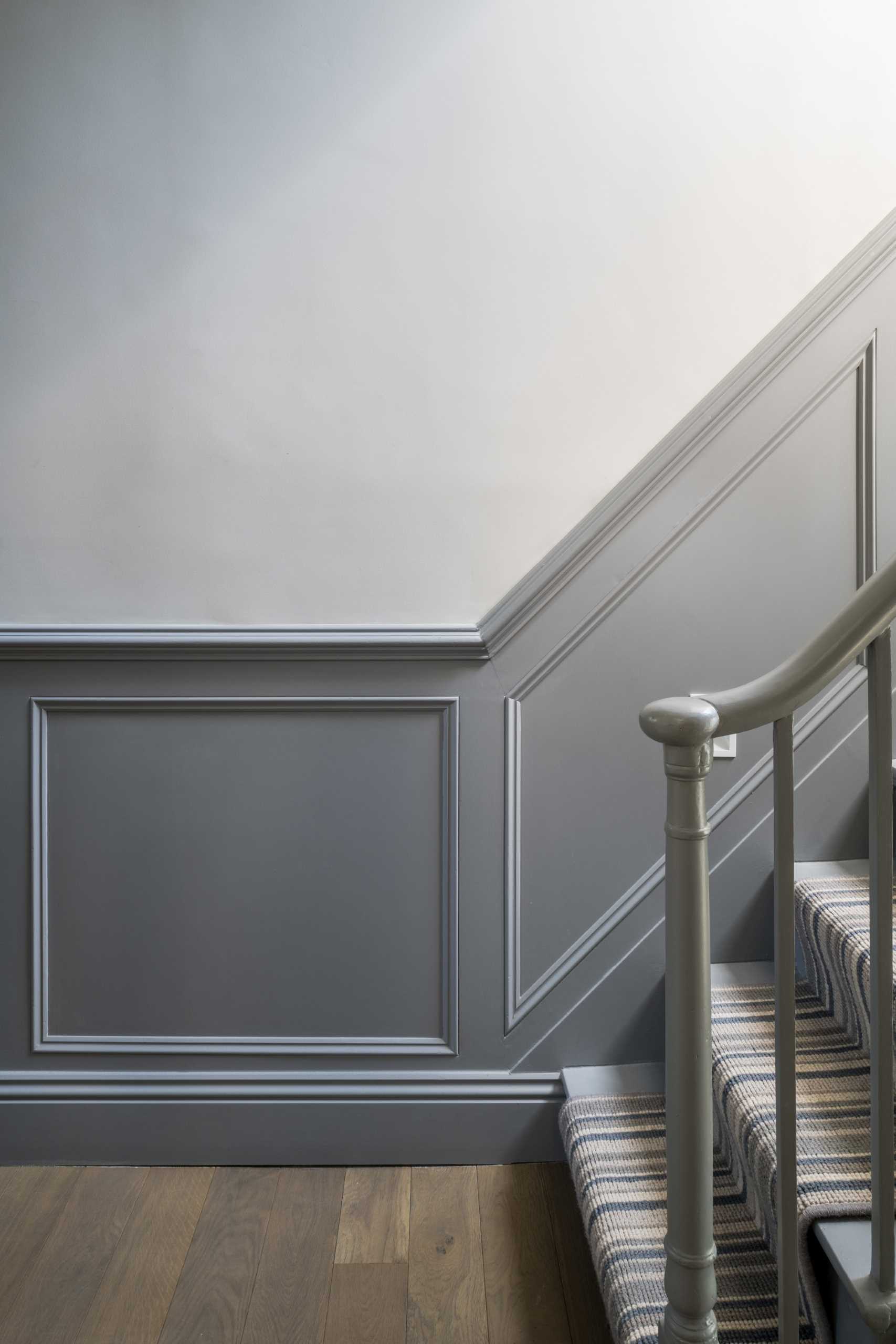 A staircase was used with grey panelling and new carpet.