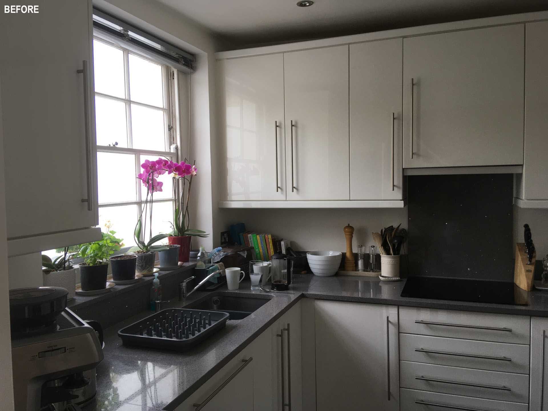 BEFORE - a small white kitchen.