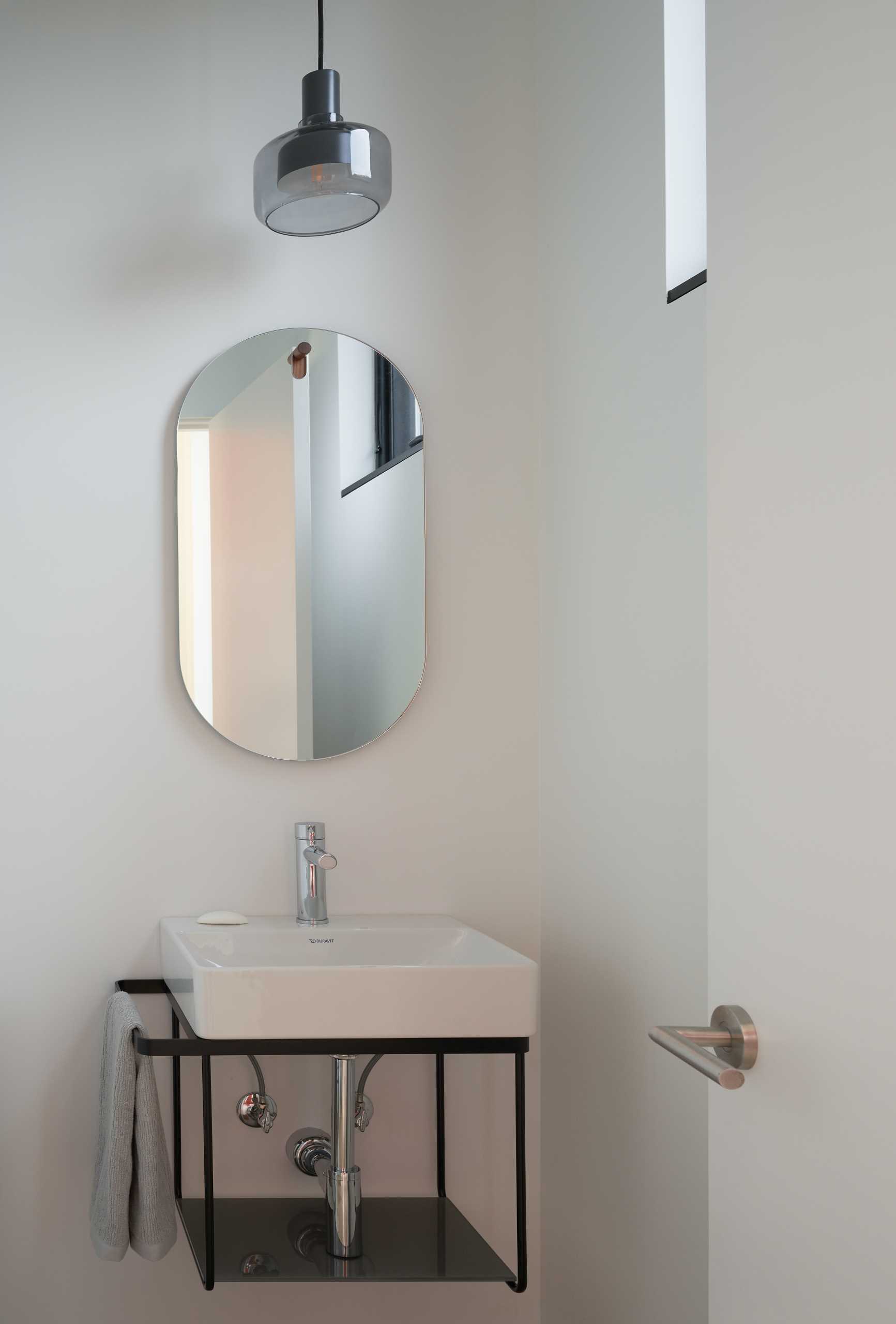 A powder room with a minimalist design.