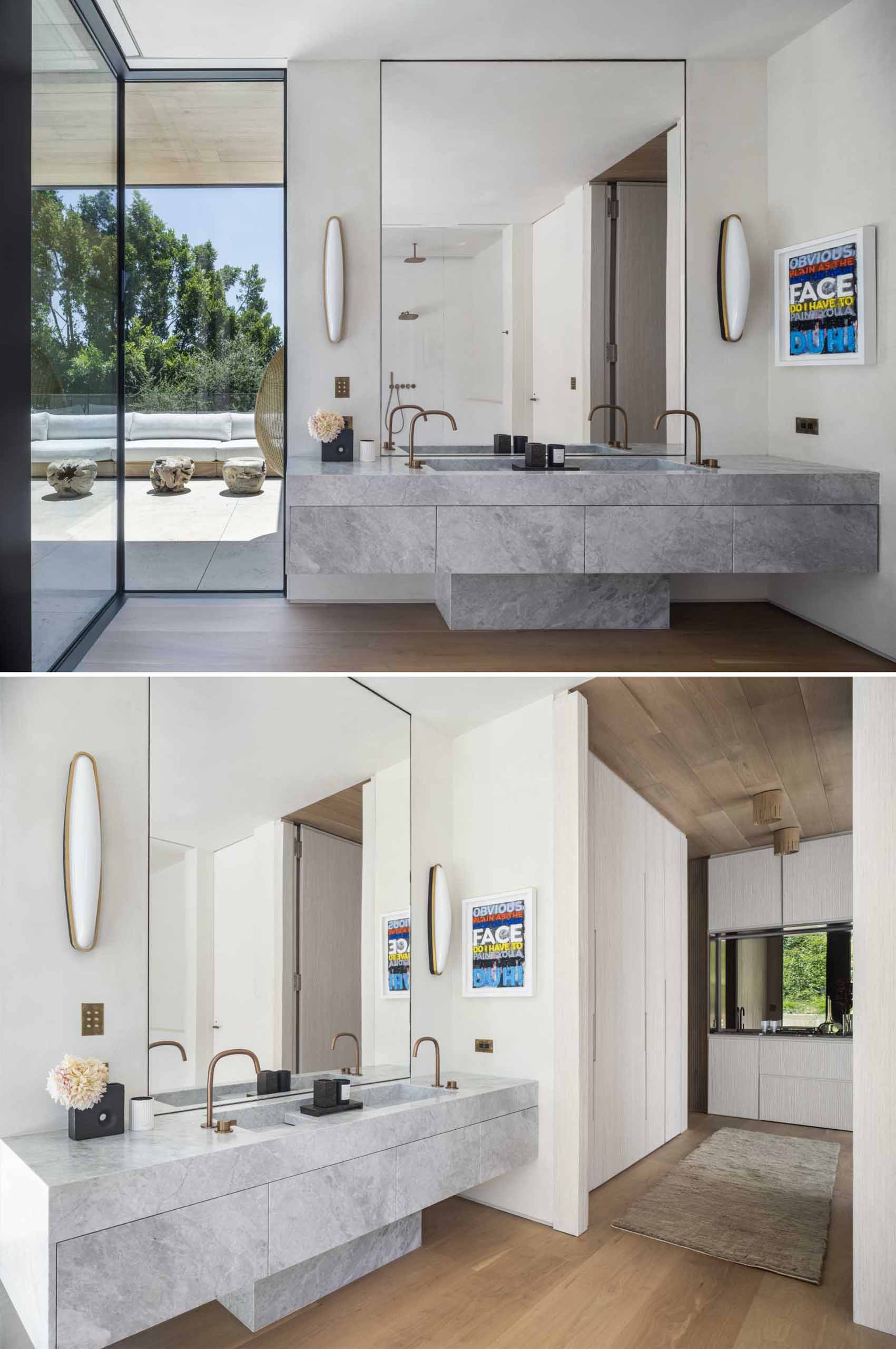 A modern bathroom with floor-to-ceiling window and a stone vanity.