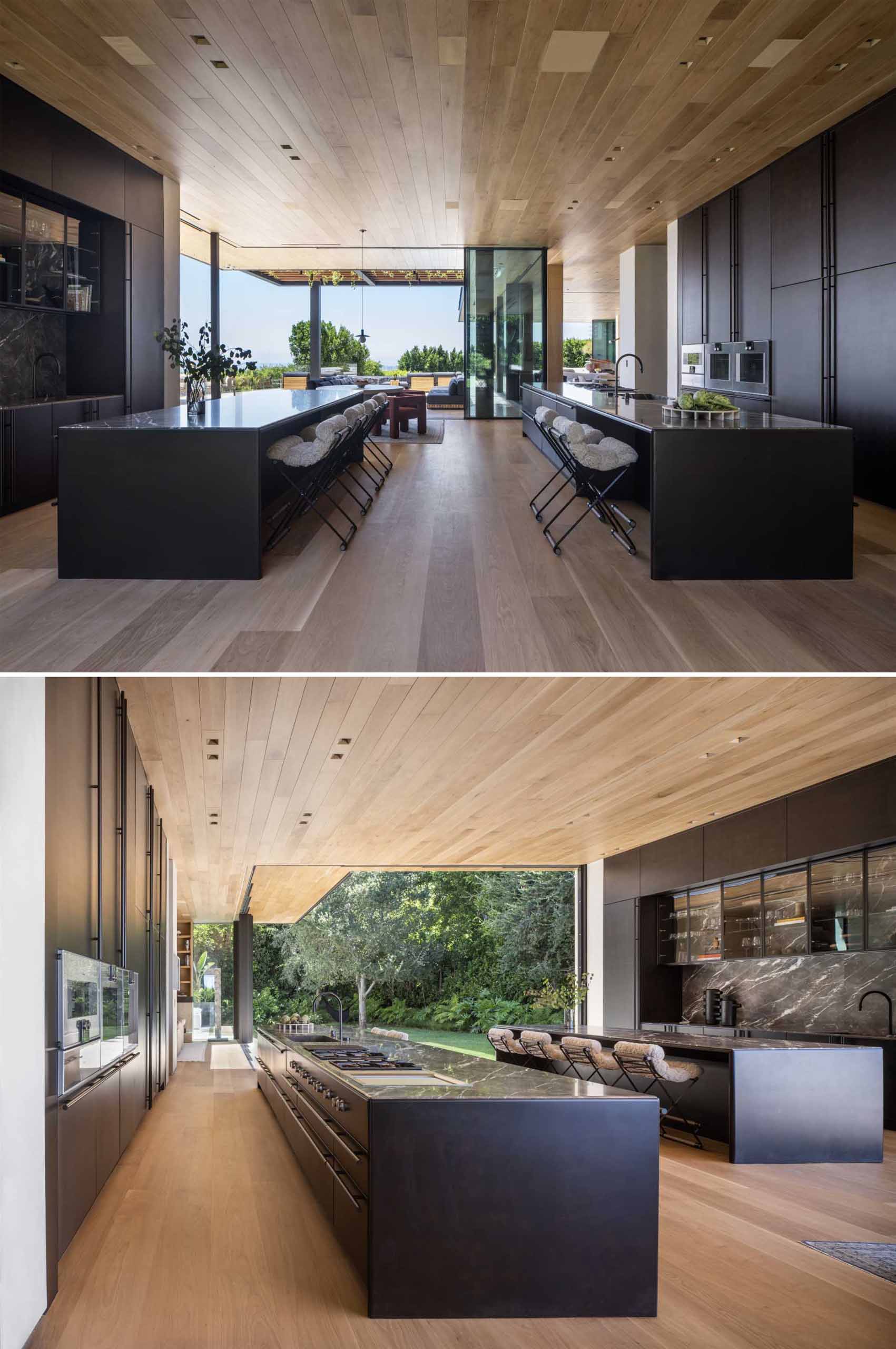 This modern kitchen makes a bold statement, with matte black cabinets and double islands.