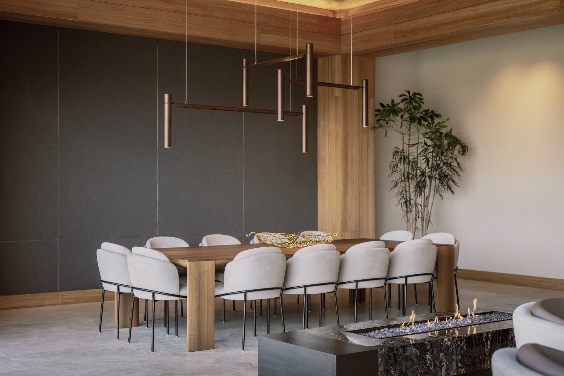 A modern dining room with a dark accent wall and hidden lighting that showcases the wood ceiling.