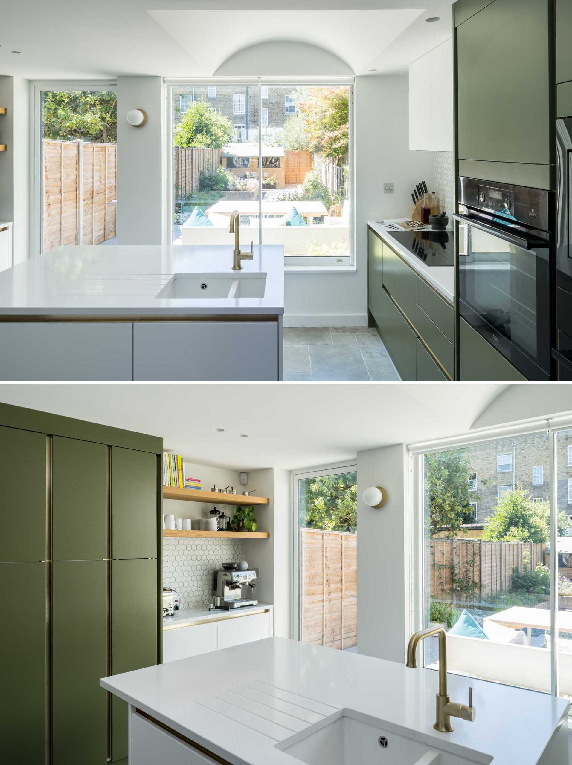 This modern kitchen, which is located in a new addition, is bright and open, and is made to feel as spacious as possible with the addition of a new skylight and with a curved ceiling above the island.