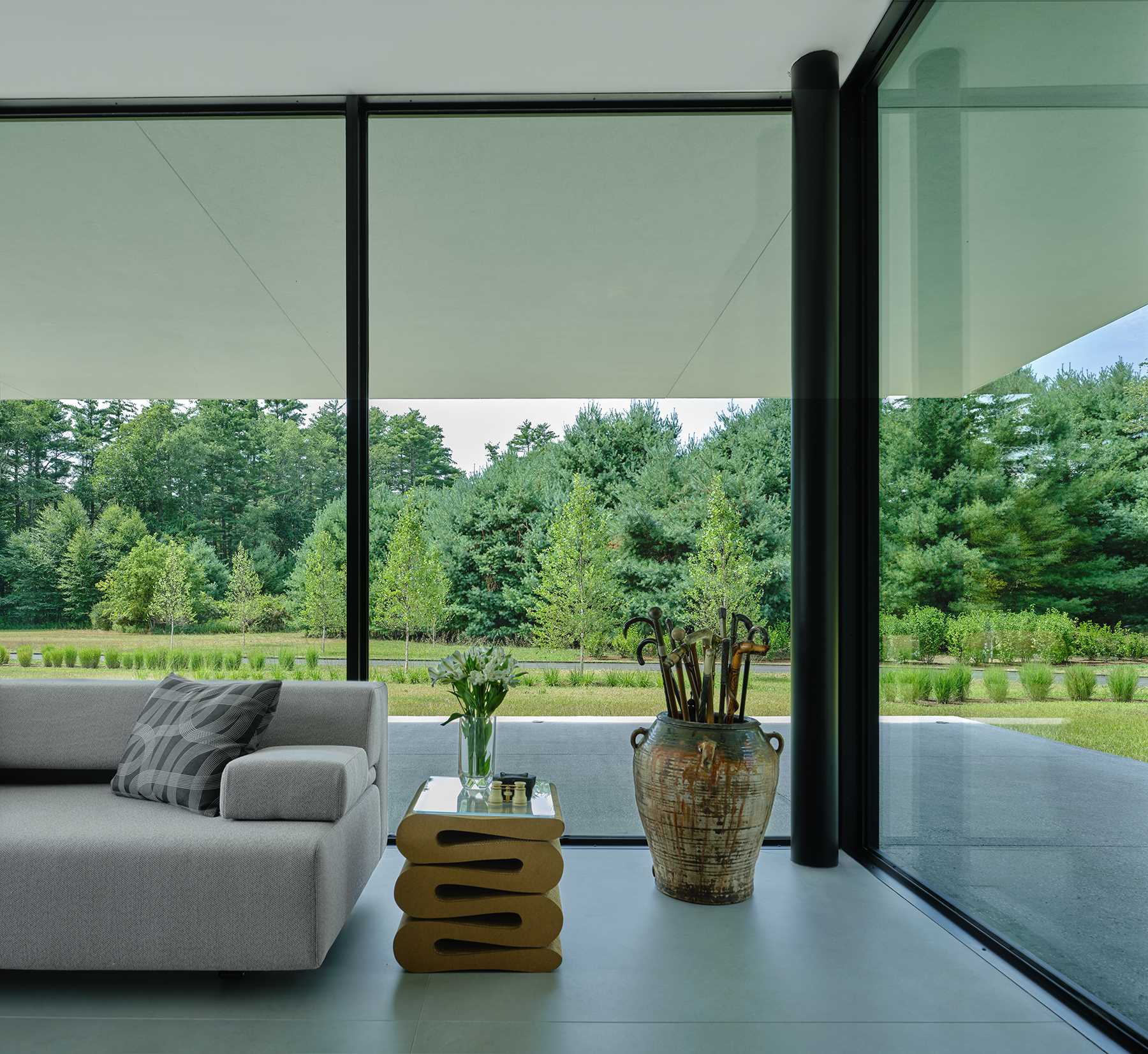 Floor-to-ceiling windows perfectly frame the tree views.
