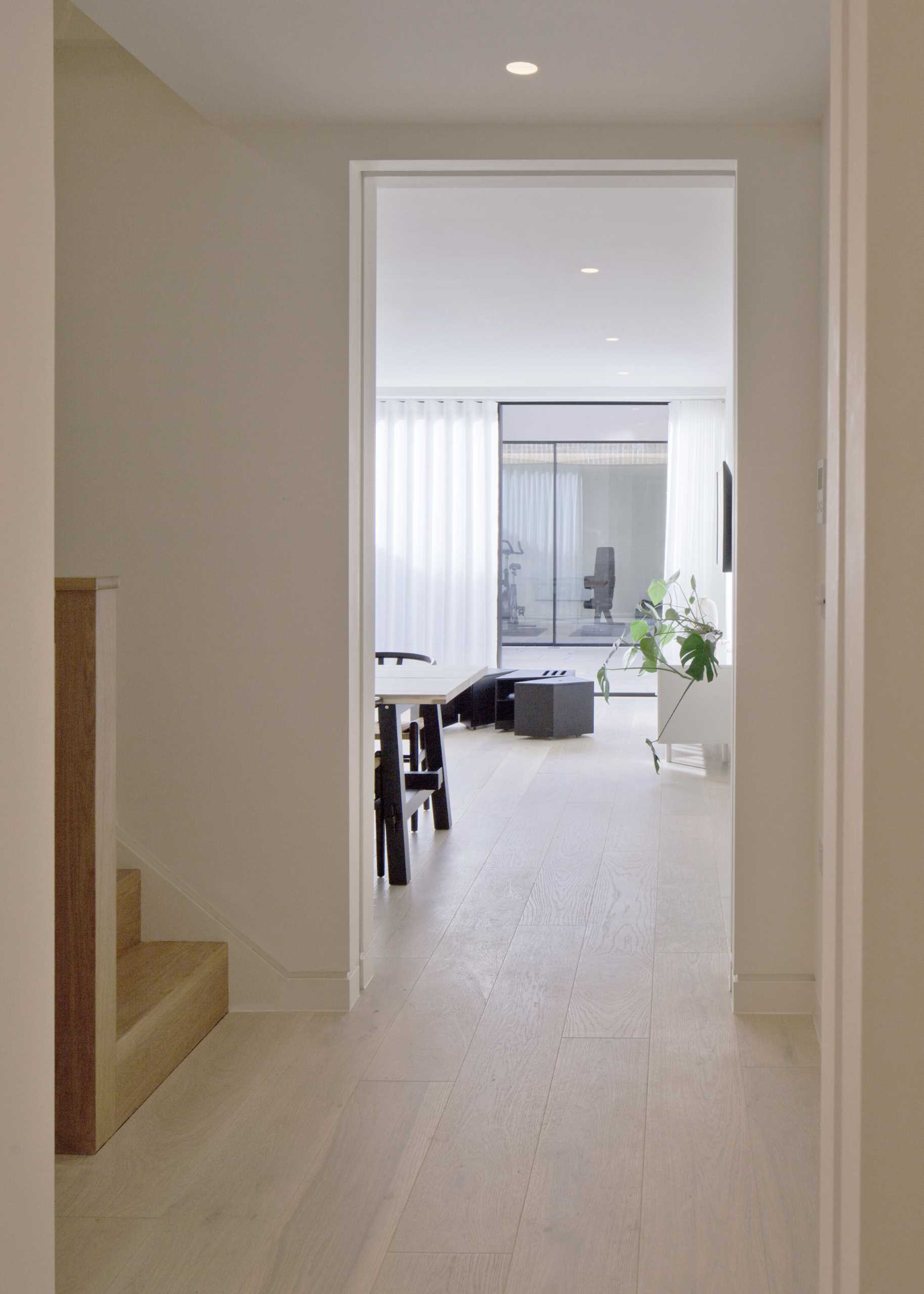 A modern townhouse interior with wood floors.