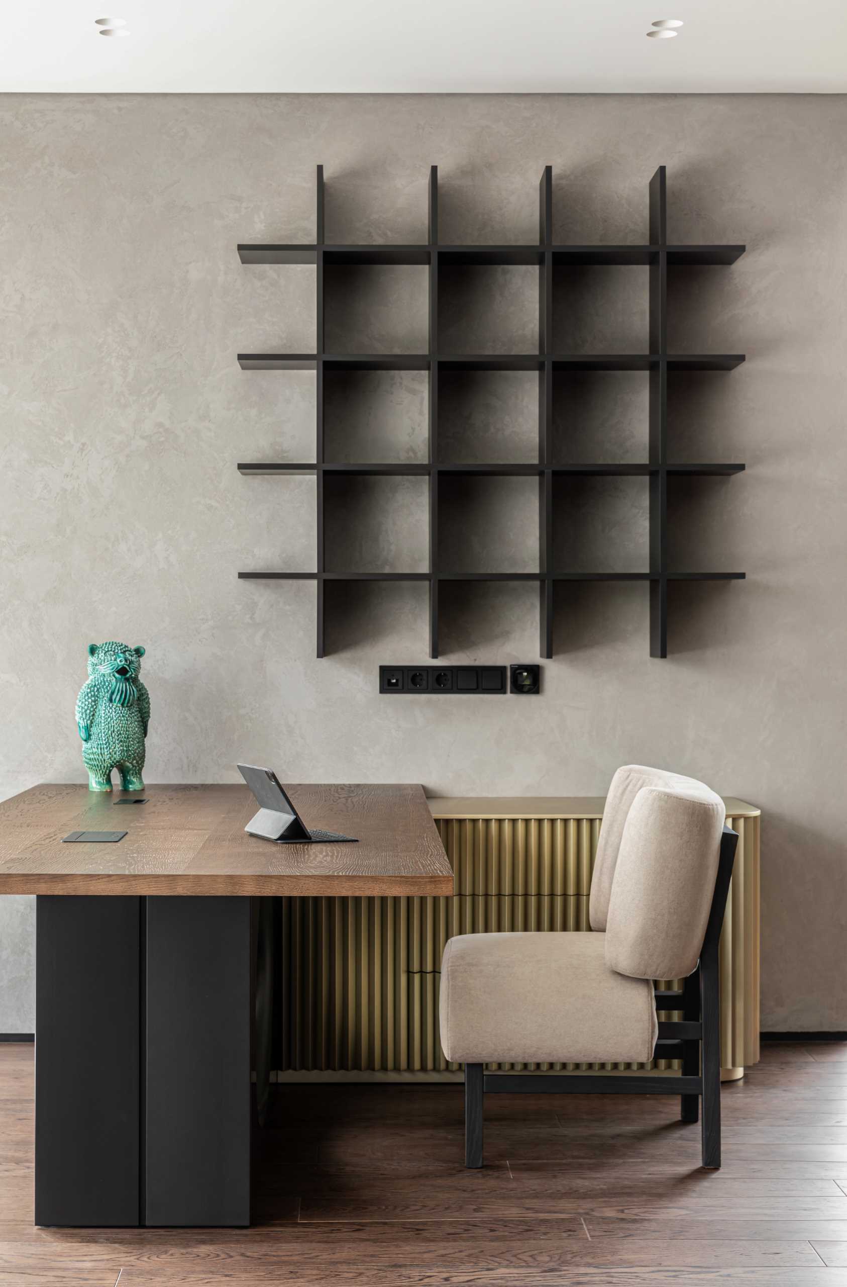 A modern home with a wood desk that faces the window.