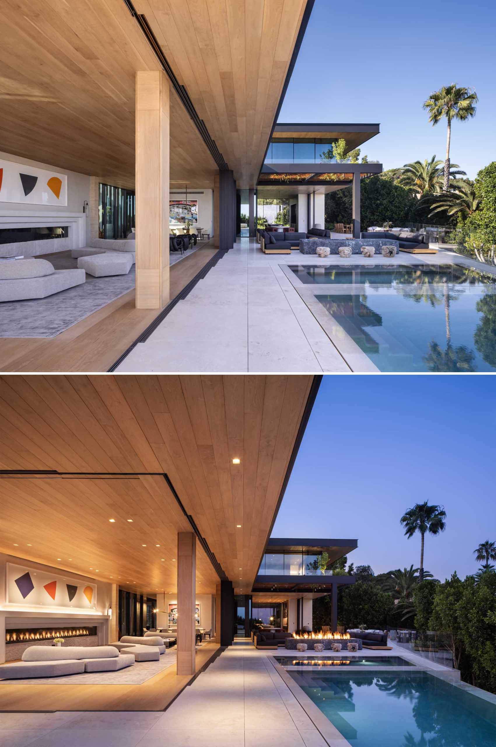 A modern home with a large living room that opens to a deck and swimming pool.