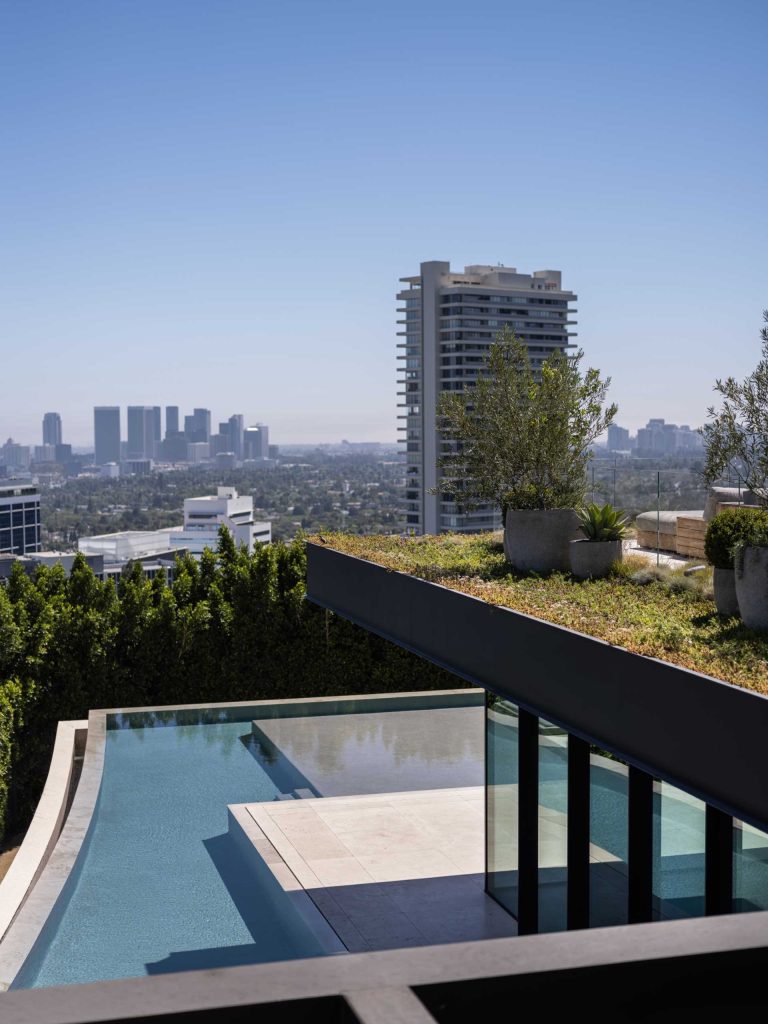 Exterior Lighting Illuminates The Landscaping Around This Modern House ...