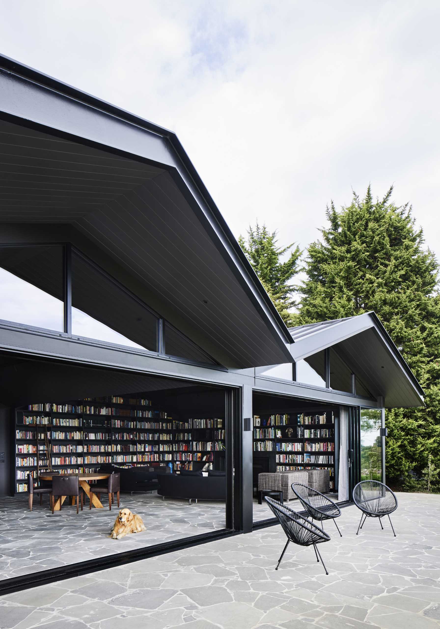 A modern farmhouse with bluestone crazy paving featured on the terrace and the interior.