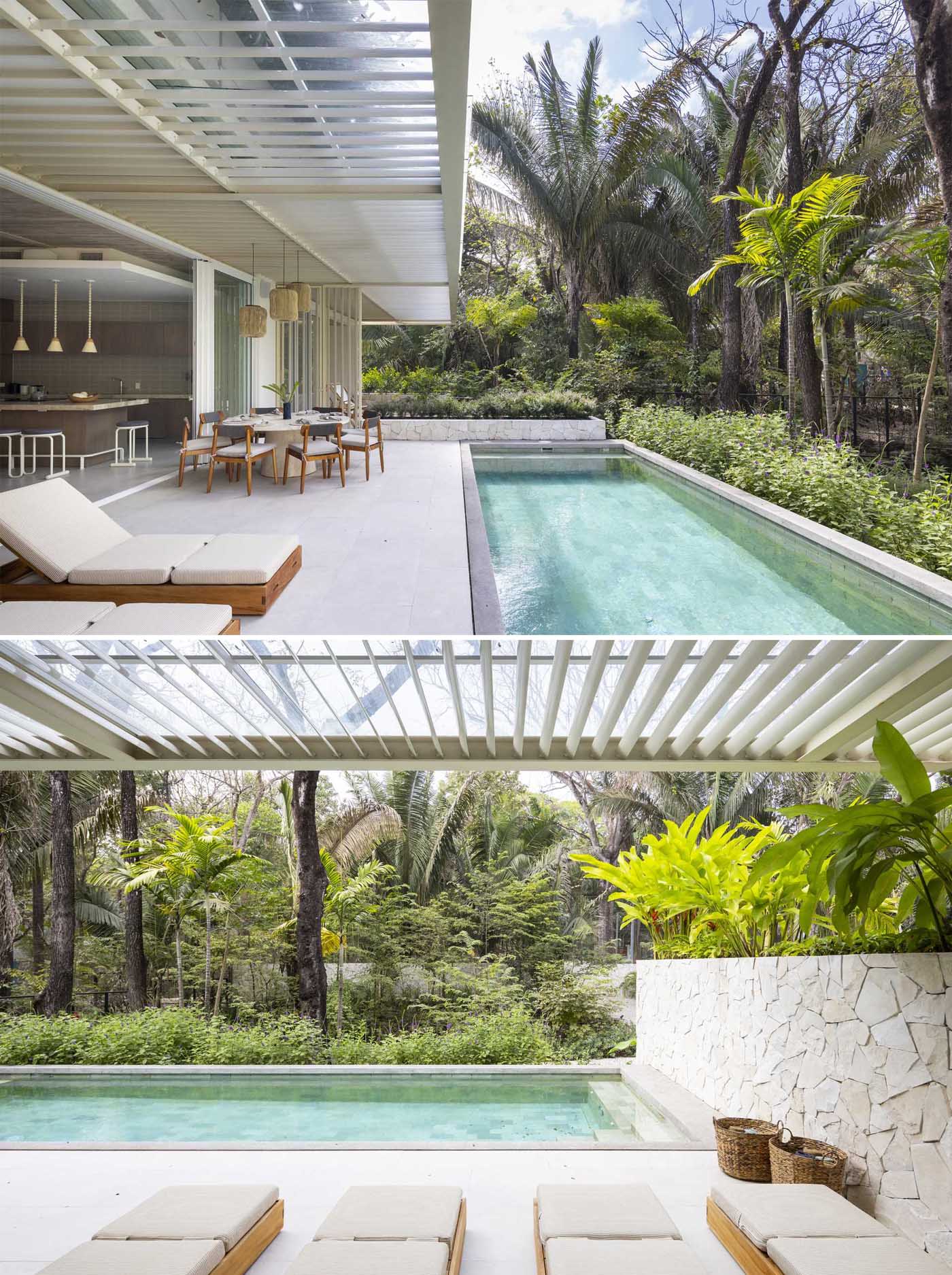 A covered outdoor dining area located off the kitchen has views of the pool, which can also be enjoyed from the sun loungers.