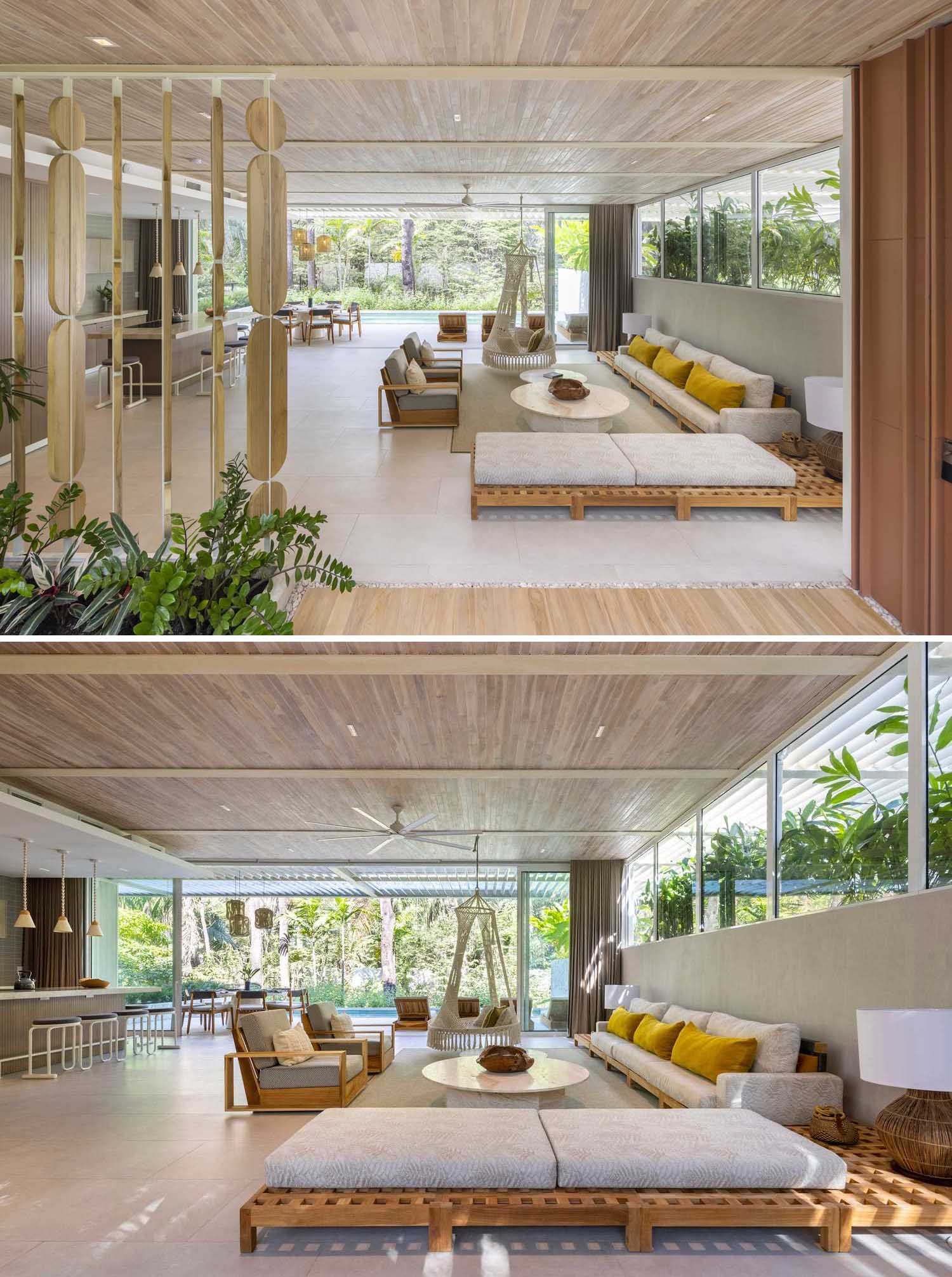 Inside this modern home, bleached teak was used for ceilings and floors and large aluminum window systems open and close completely to allow for full flexibility of space.