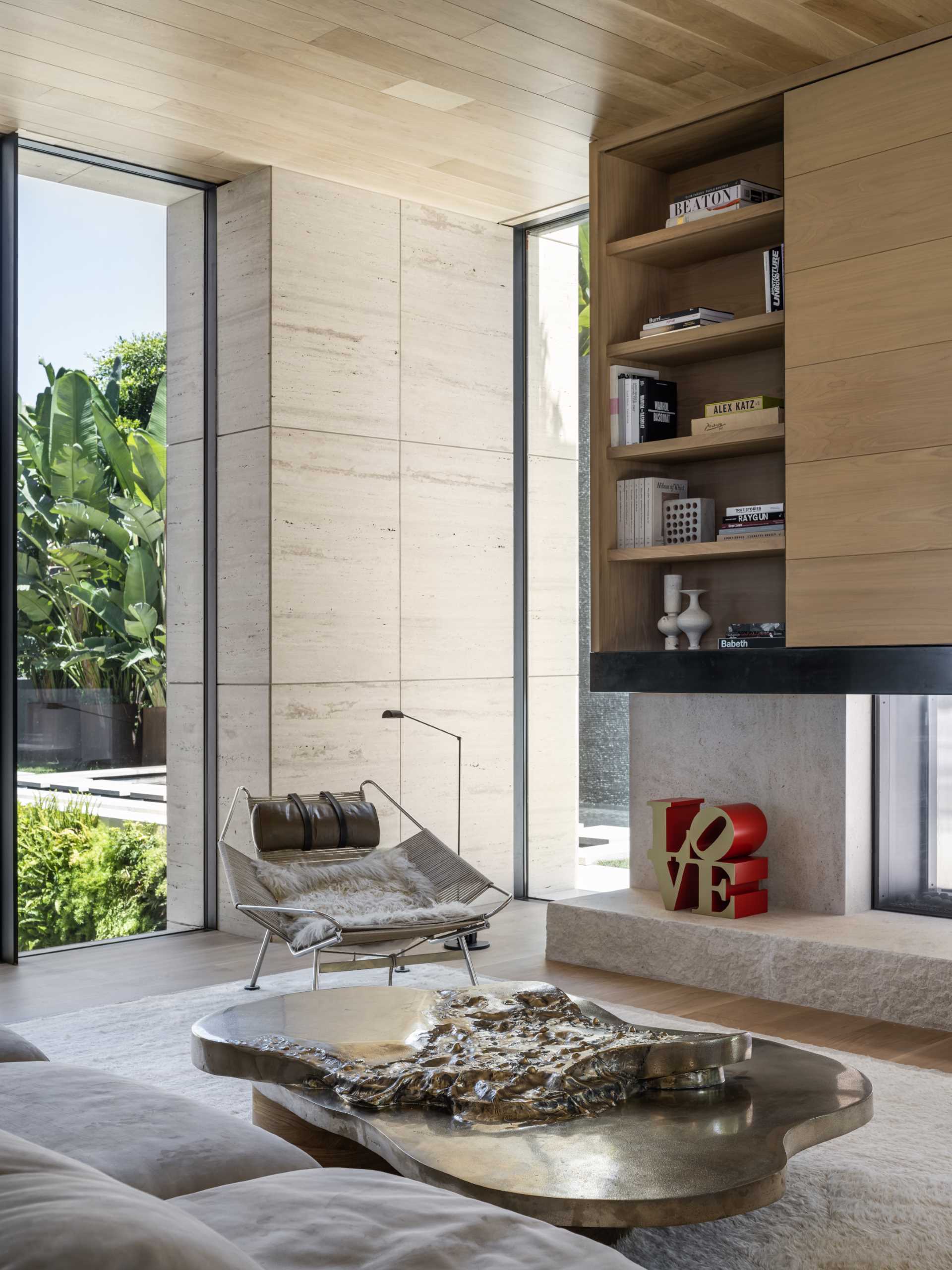 A modern living room with floor-to-ceiling windows.