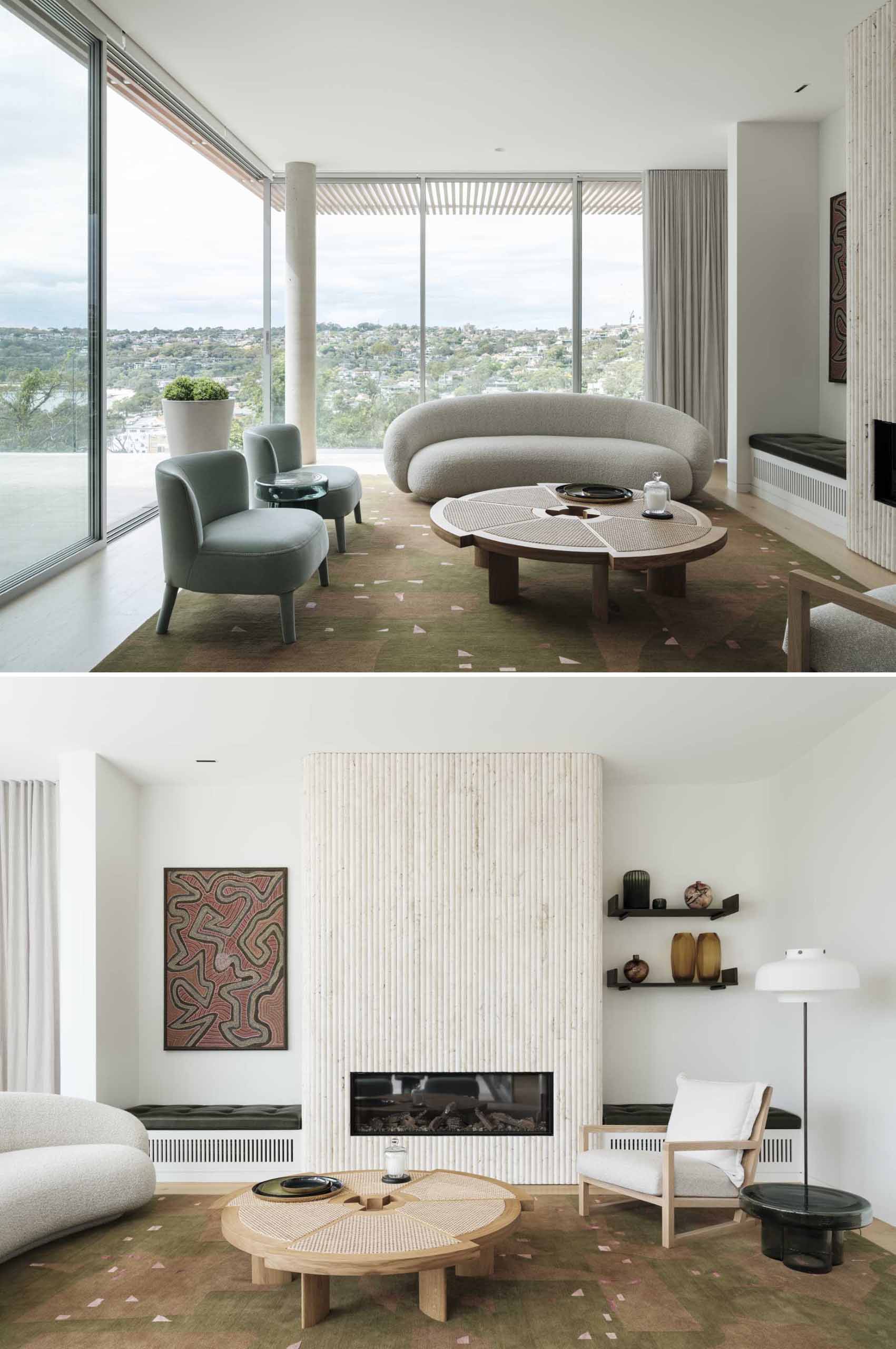 In this modern living room, floor-to-ceiling windows fill the room with natural light and a fluted fireplace surround adds a textural element.