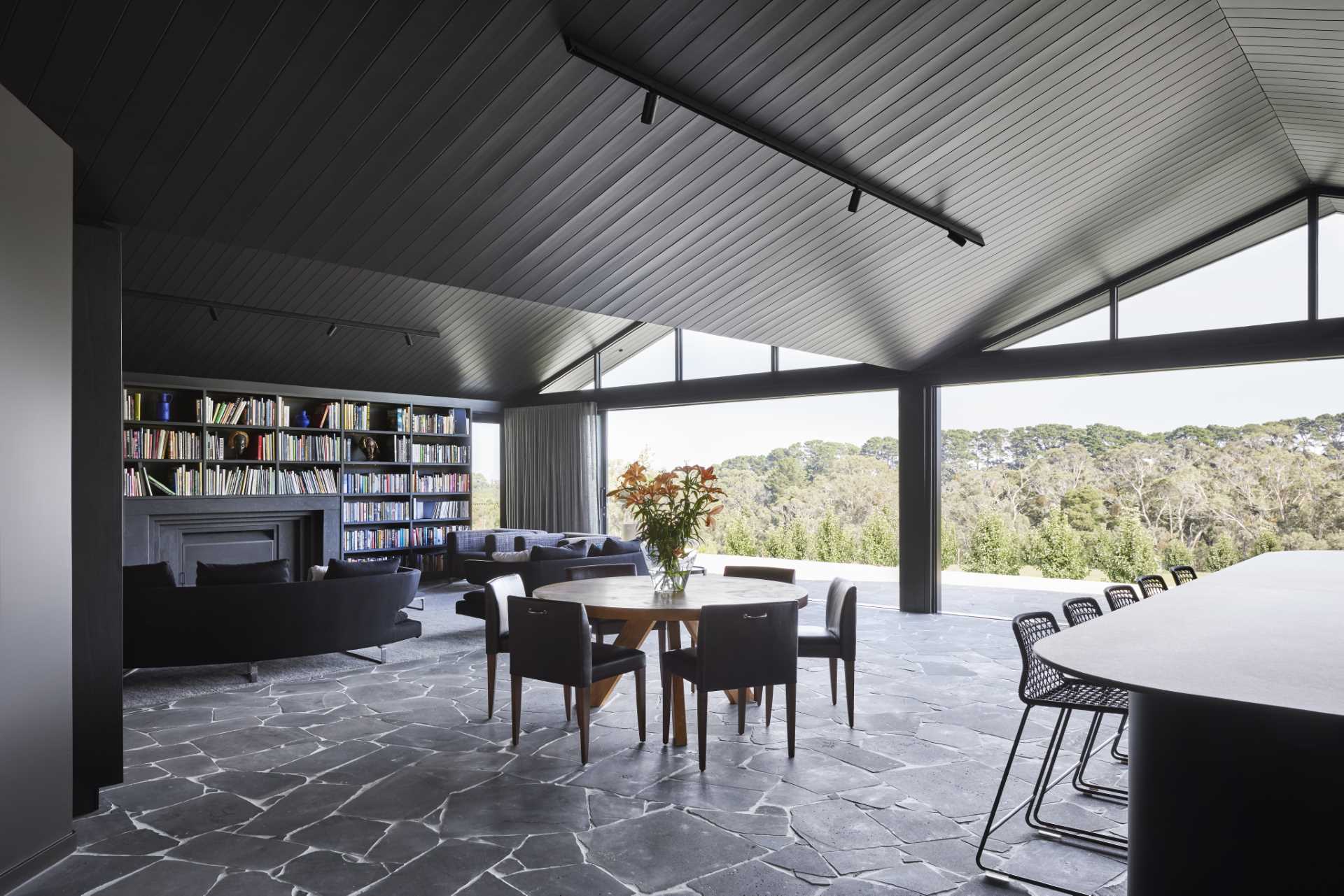 A modern farmhouse dining area with bluestone crazy paving flooring throughout.