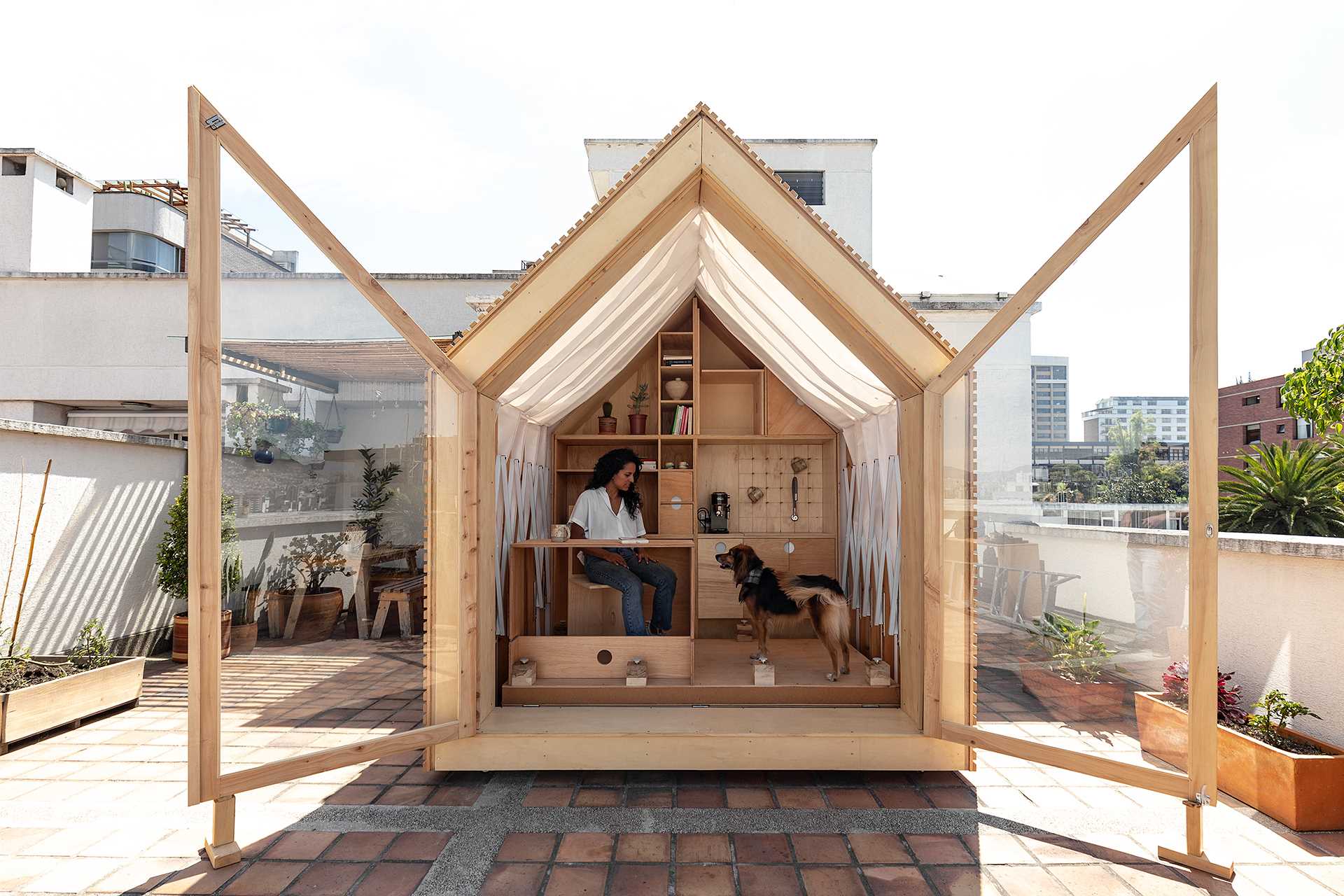 Architects Juan Ruiz and Amelia Tapia have designed a small cabin-like room that expands when needed.