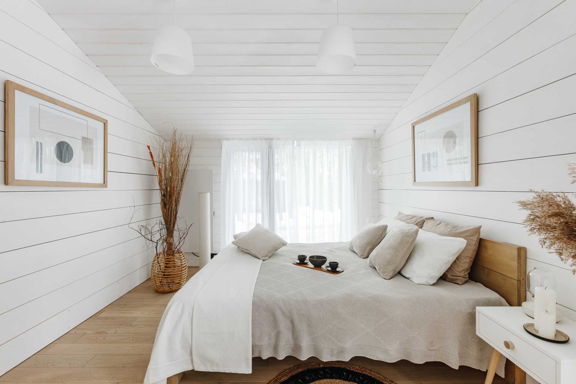 A contemporary white and wood bedroom.