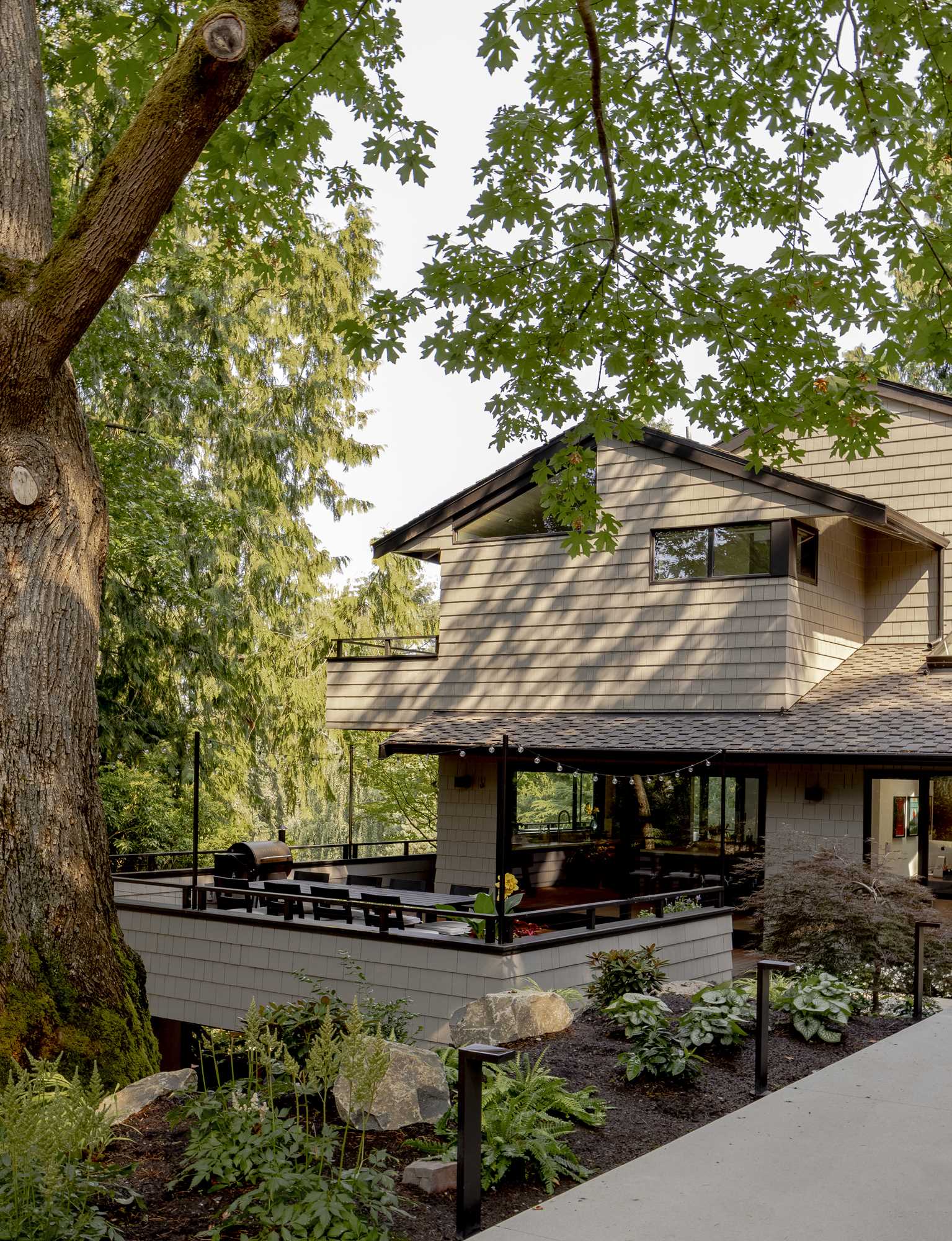 The contemporary remodel of a 1970s home included an updated exterior and interior, and a new deck.