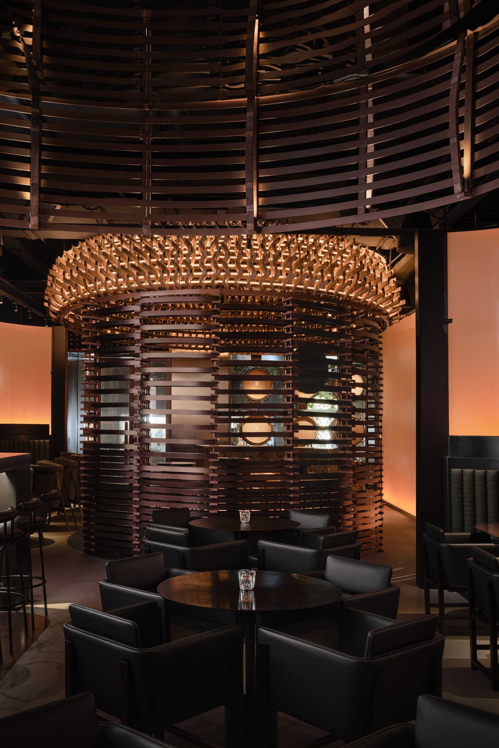 6000 pieces of discarded wooden whiskey barrels were recycled to make this modern bar.