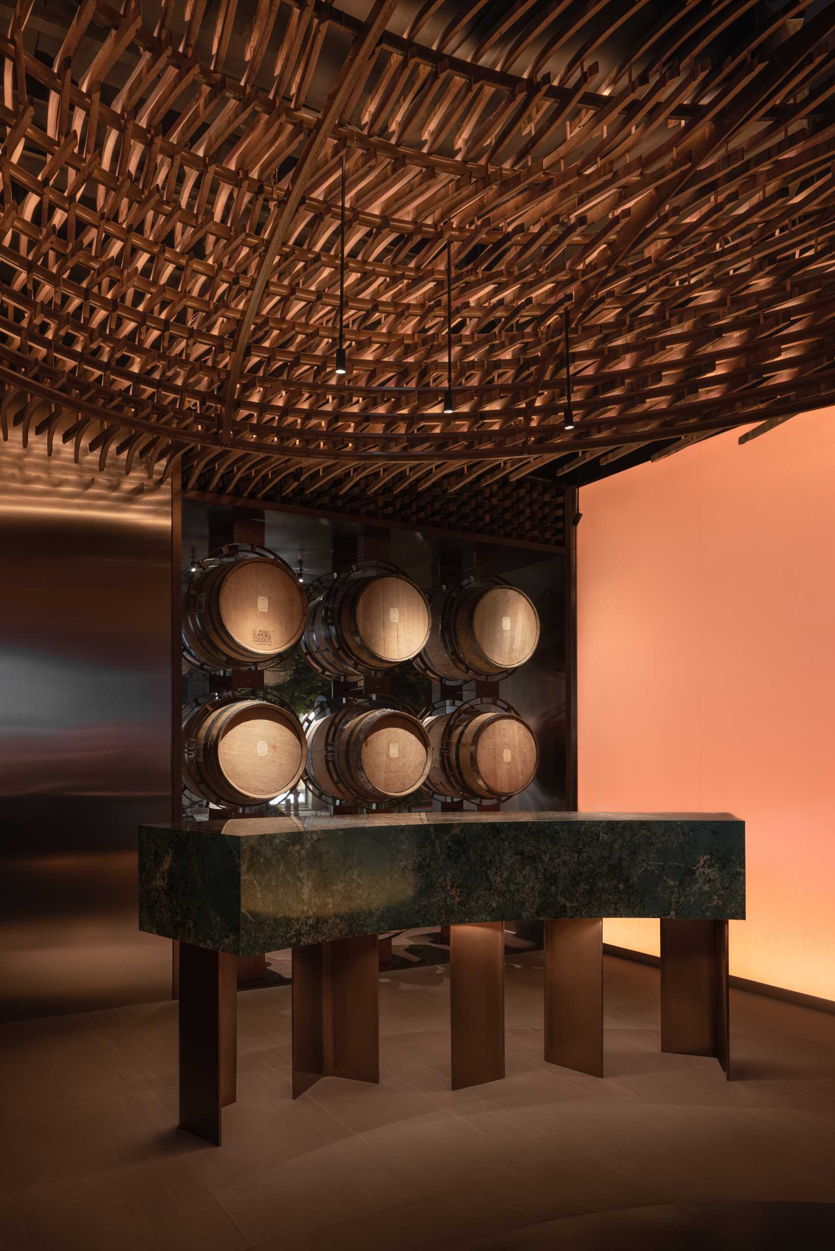 6000 pieces of discarded wooden whiskey barrels were recycled to make this modern bar.