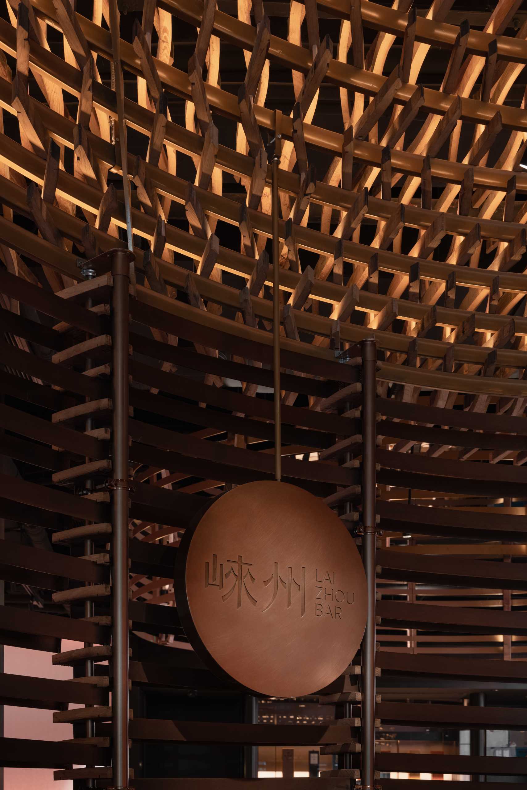 6000 pieces of discarded wooden whiskey barrels were recycled to make this modern bar.