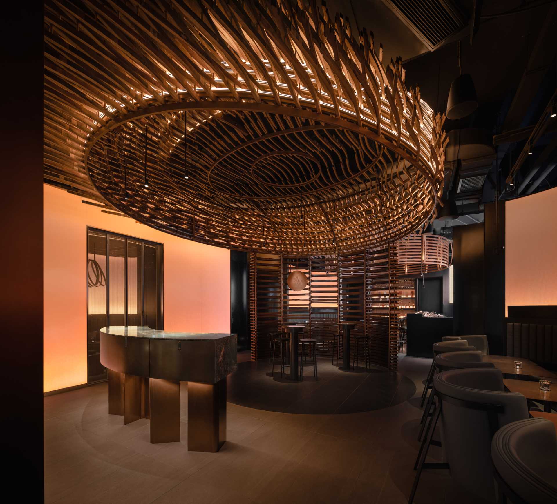 6000 pieces of discarded wooden whiskey barrels were recycled to make this modern bar.