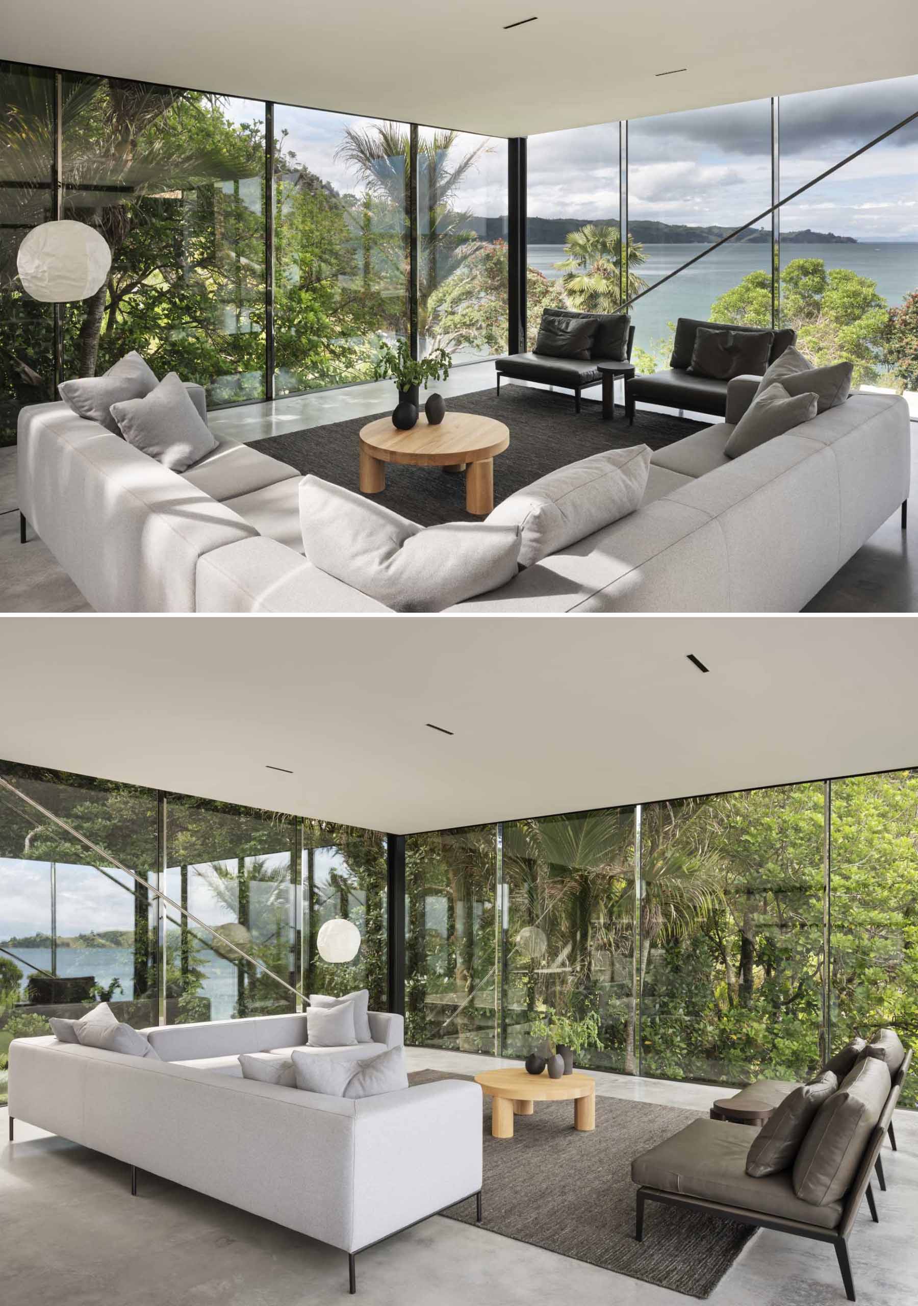 A modern home includes a living room with glass walls on three sides.