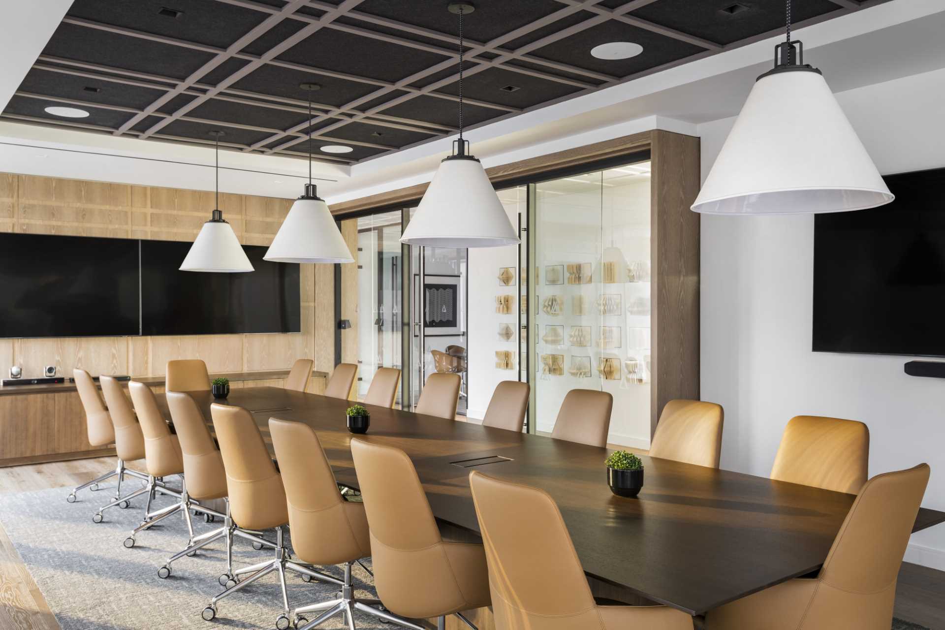 A modern meeting room with a plaid-inspired wood accent wall.
