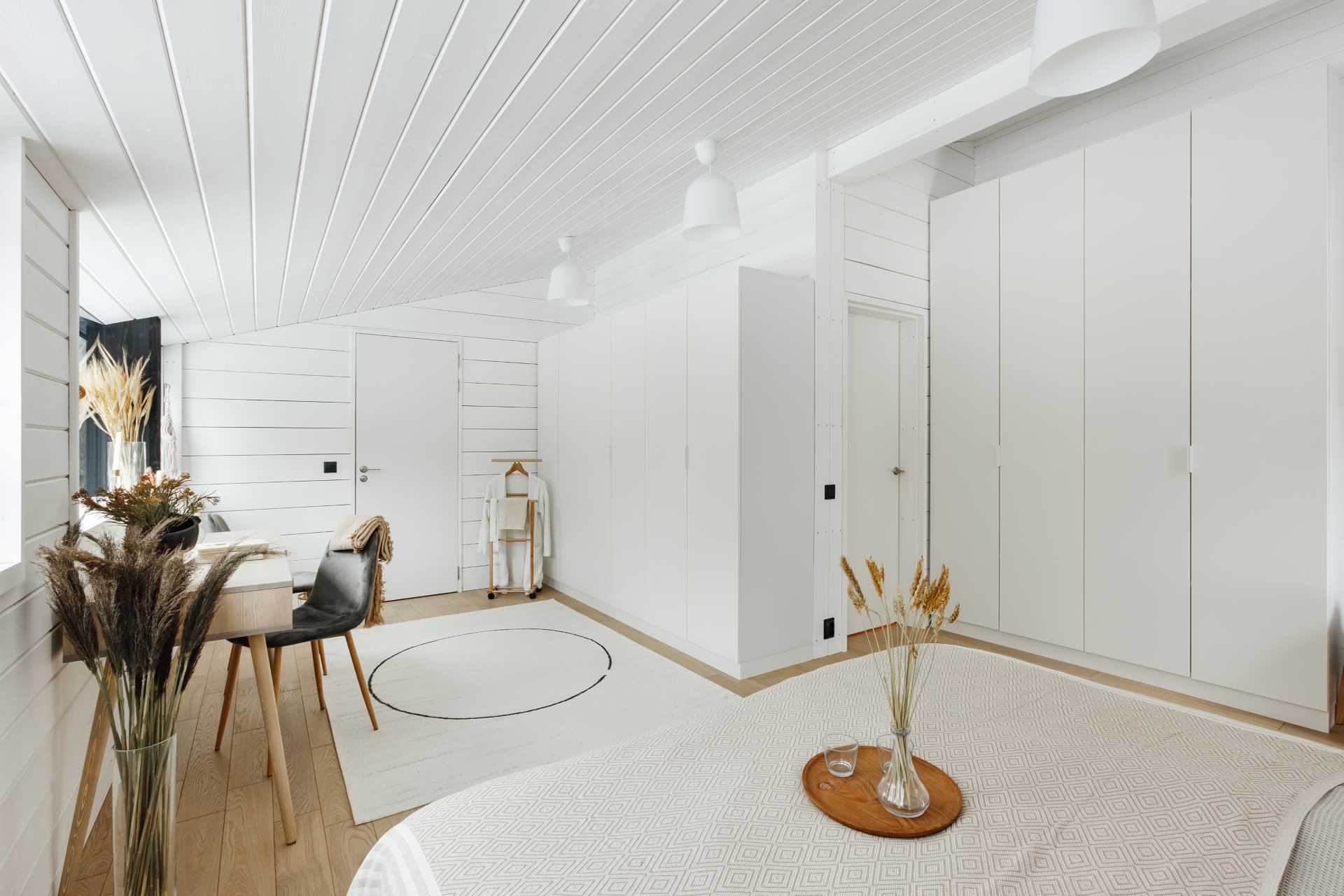 A contemporary white and wood bedroom.