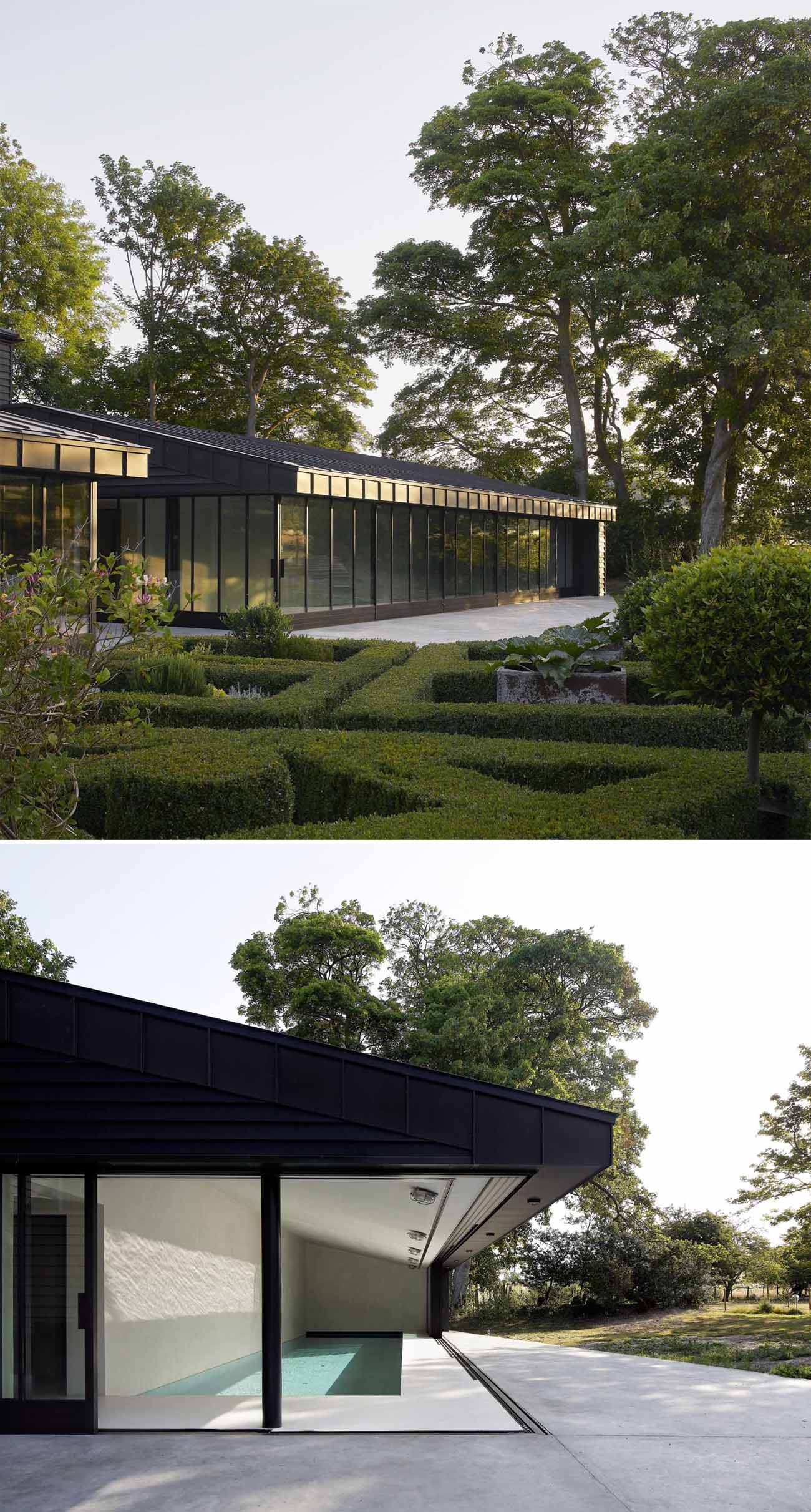 A modern pool house with an indoor pool and sliding glass walls.