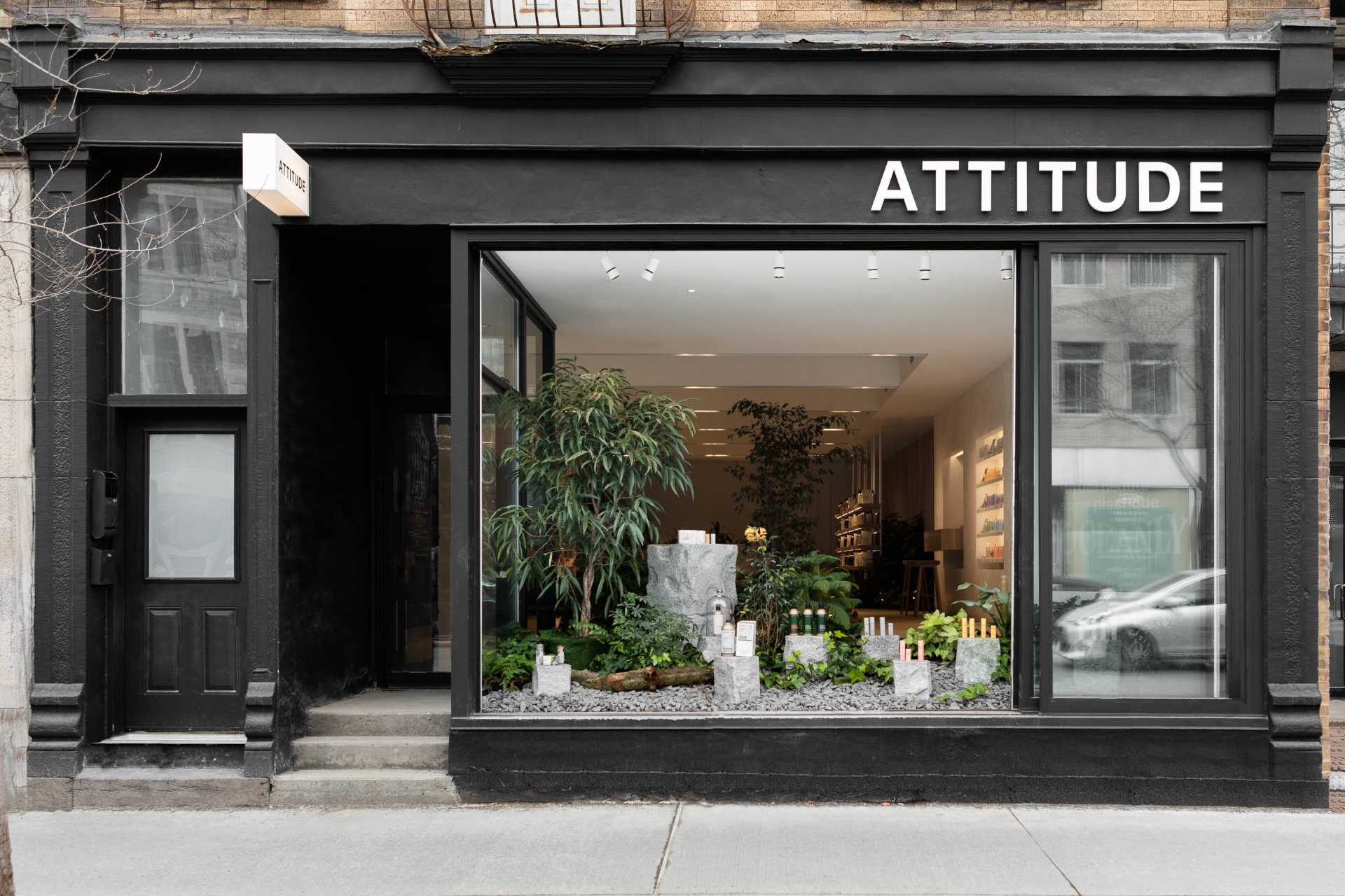 A modern retail store with built-in planters throughout.