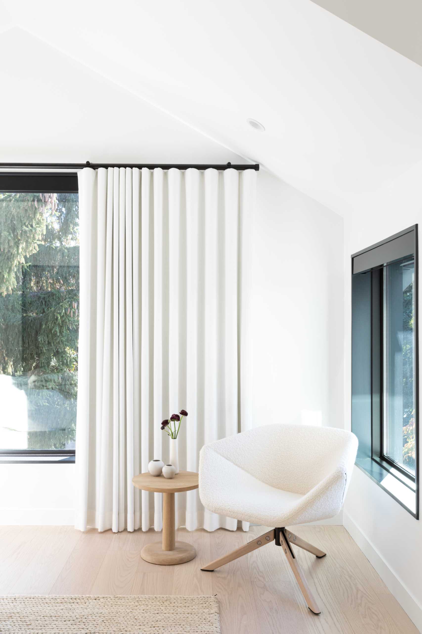 A modern bedroom with a neutral color palette.