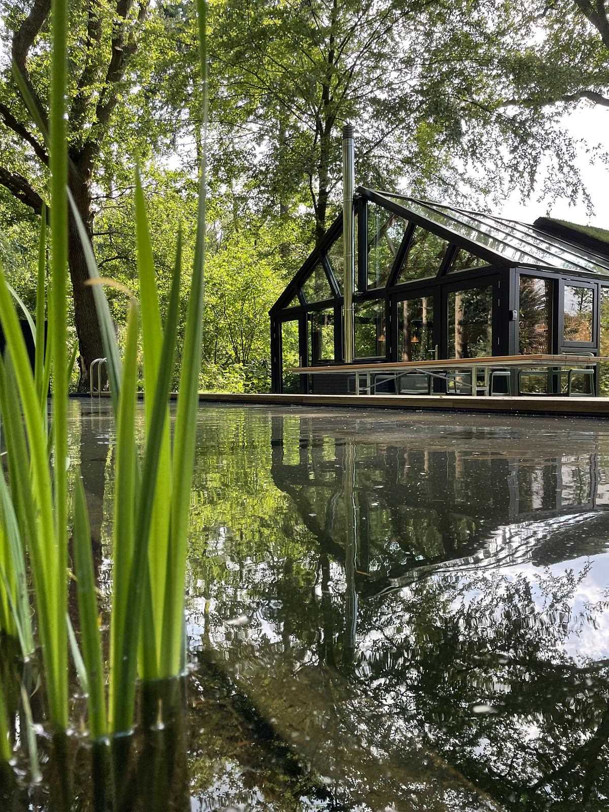 The small house has a footprint of 538 square feet (50m2), which includes 3 levels, the main level with the living room and kitchen, a sunken bathroom downstairs, and two bedrooms upstairs.