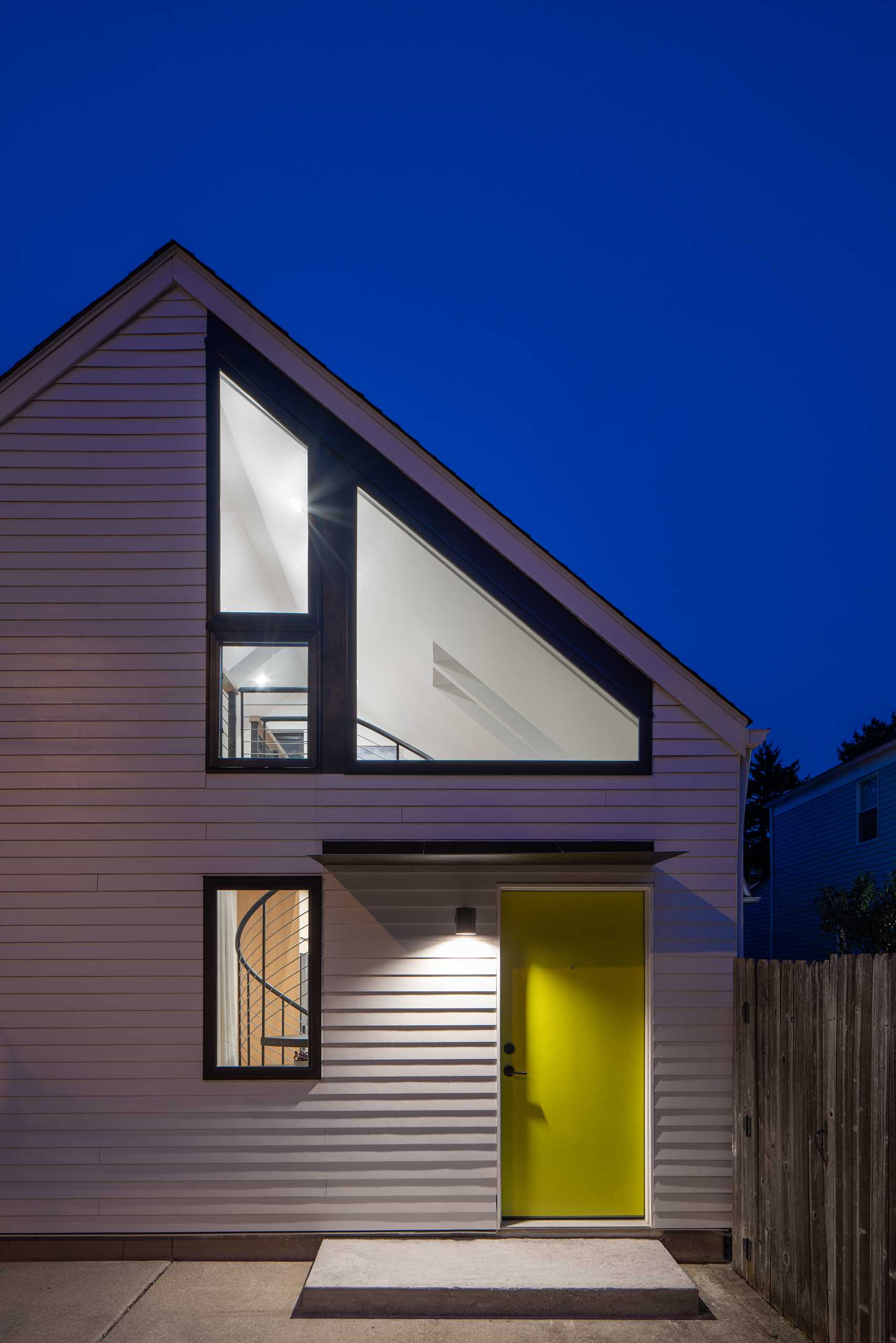 A garage was transformed into a studio apartment with a lofted home office.