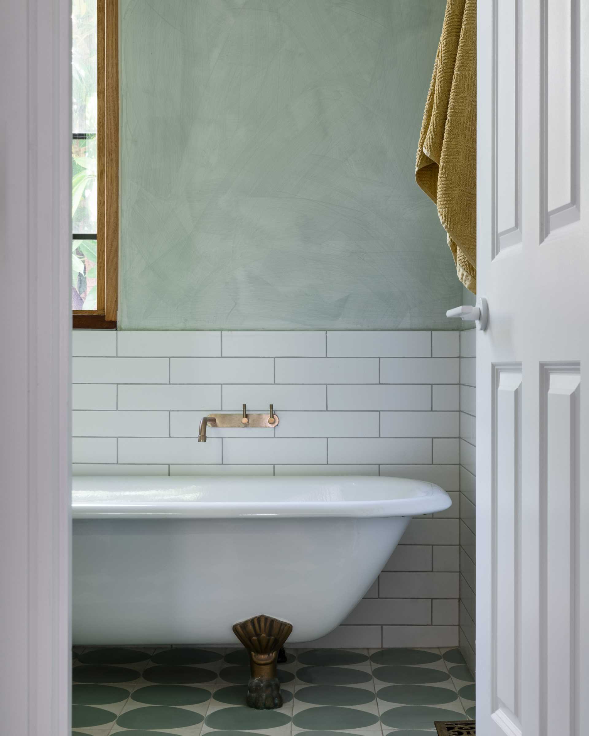 A new bathroom with a clawfoot tub that was restored.