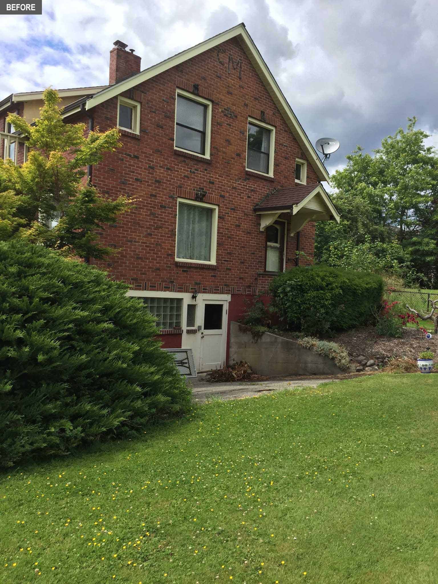 BEFORE -  A brick farmhouse from the 1930's.