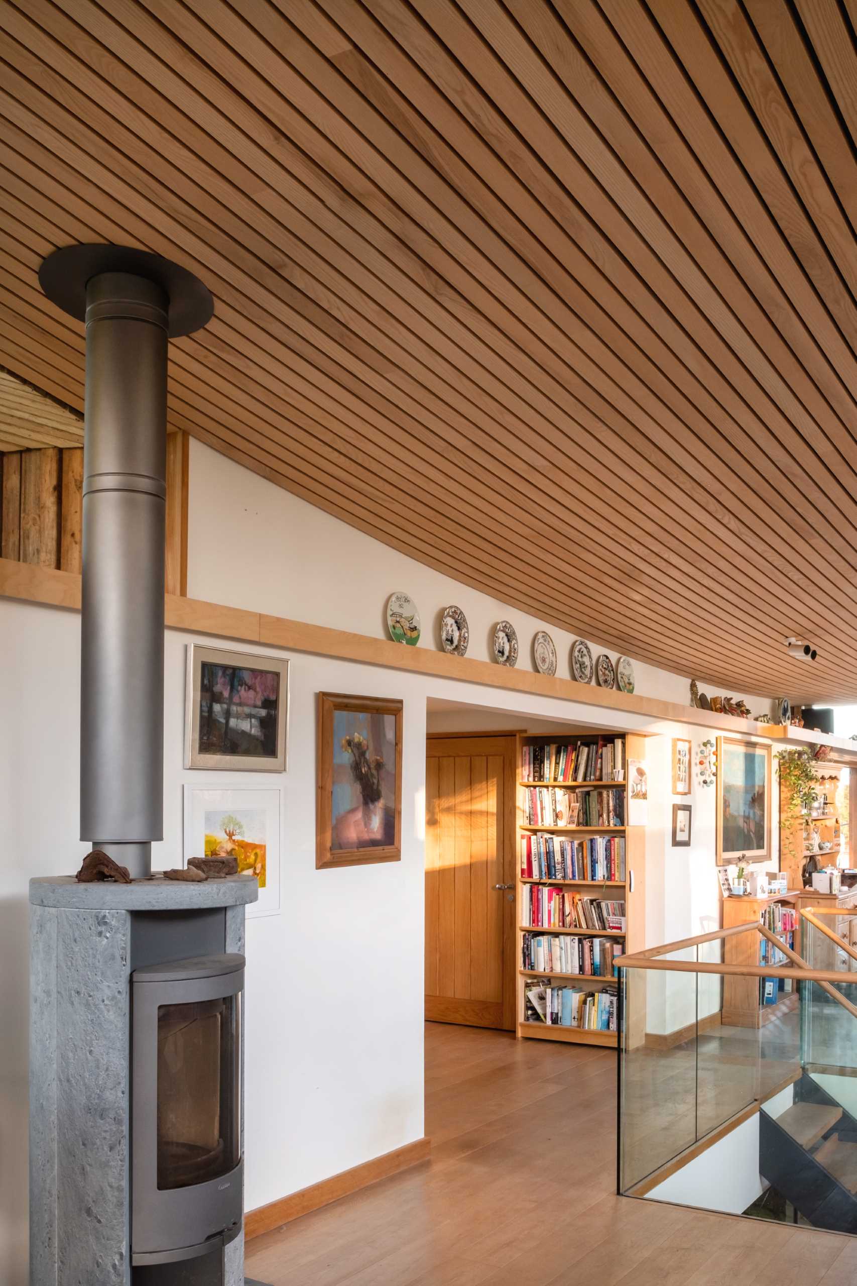 A contemporary cabin with wood accents and a fireplace.