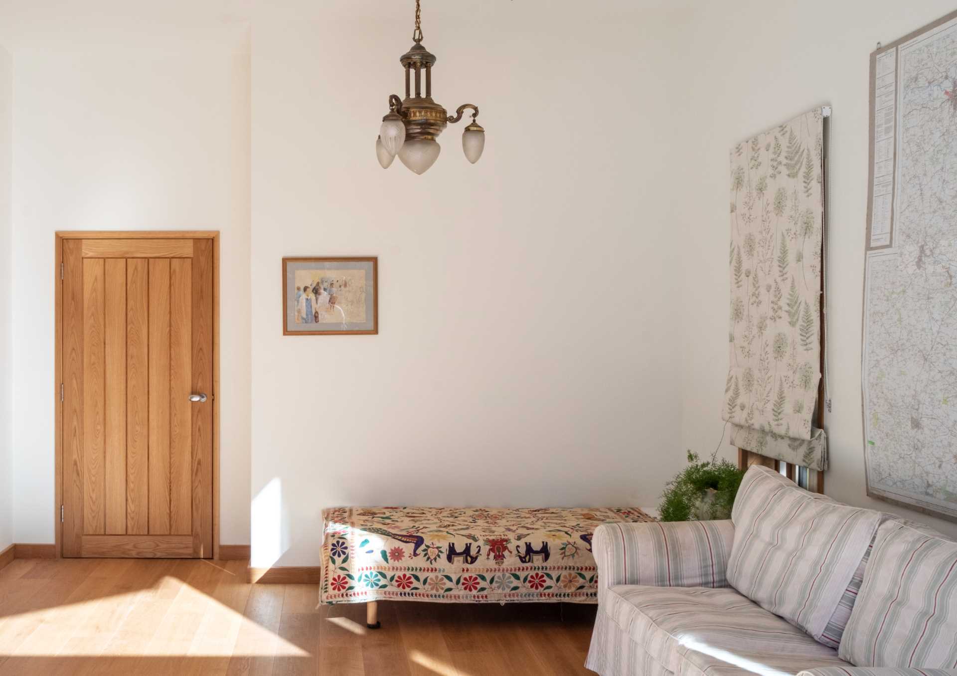 A cabin with a simple interior and a wood door.