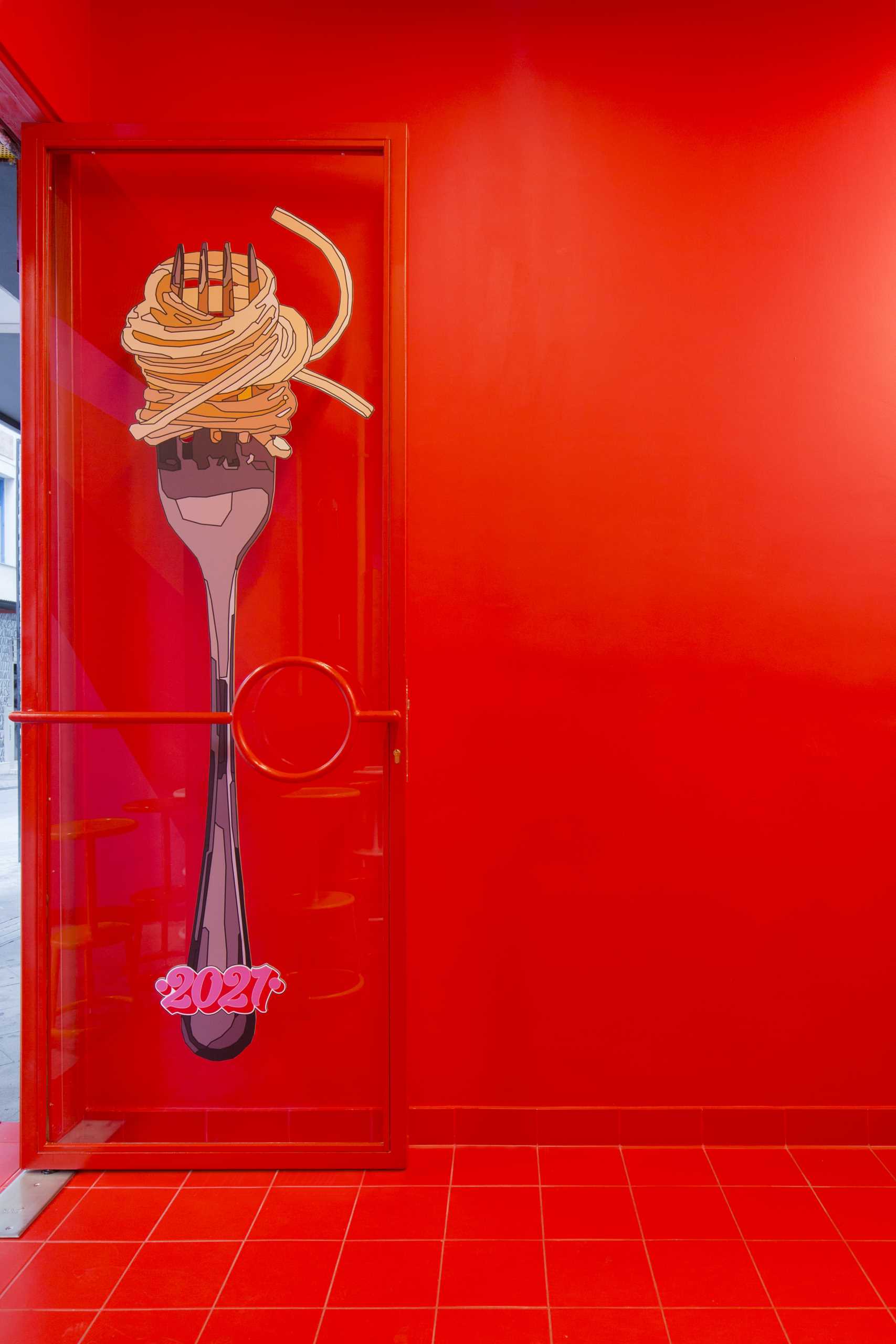 The door illustration of this pasta shop, depicts the classic pasta twirl on a fork, that works as a mouthwatering trigger for any unsuspecting passerby.