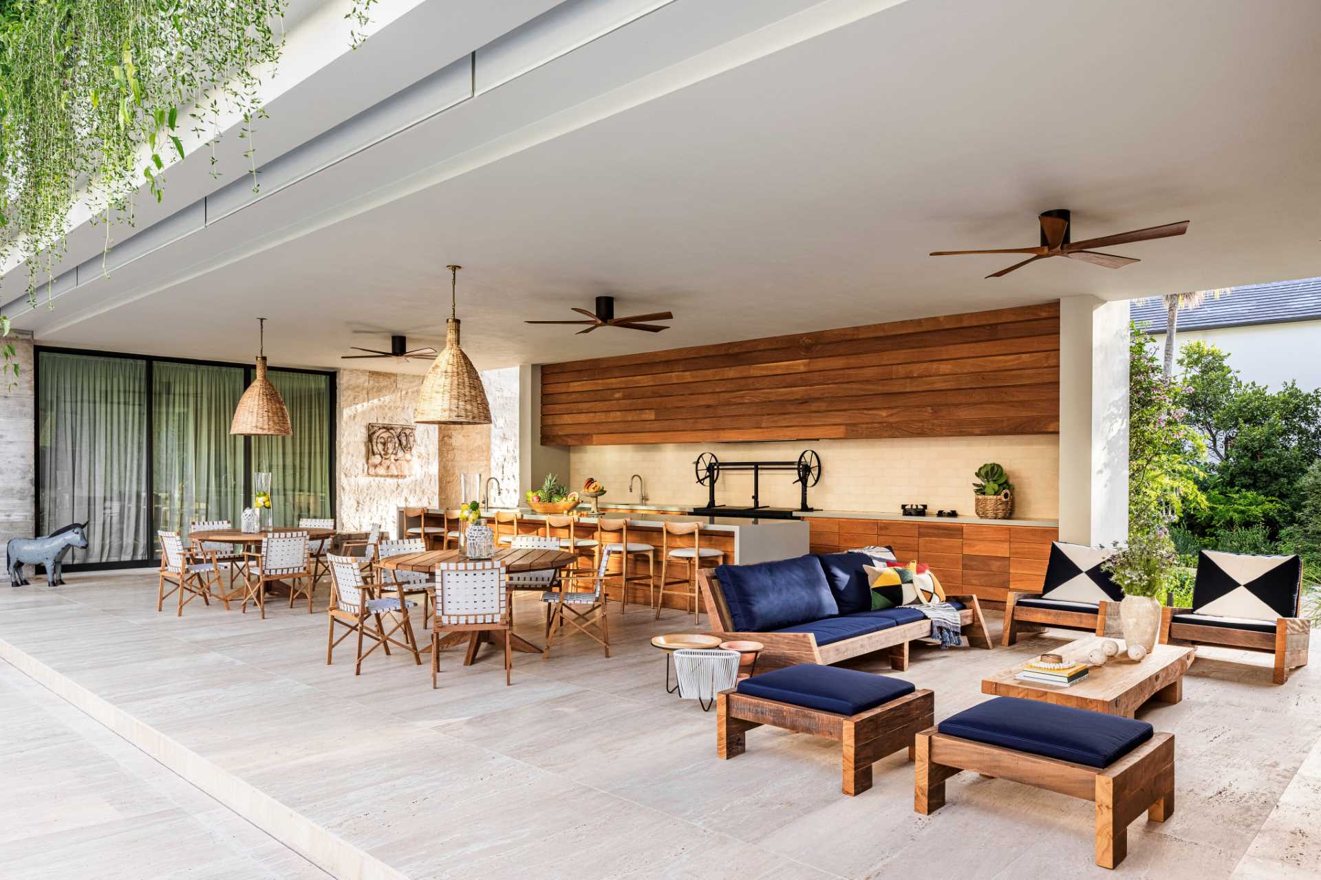 Unfilled travertine flooring crosses from the covered patio, which has been designed for entertaining, to the interior, creating an overall sense of warmth.