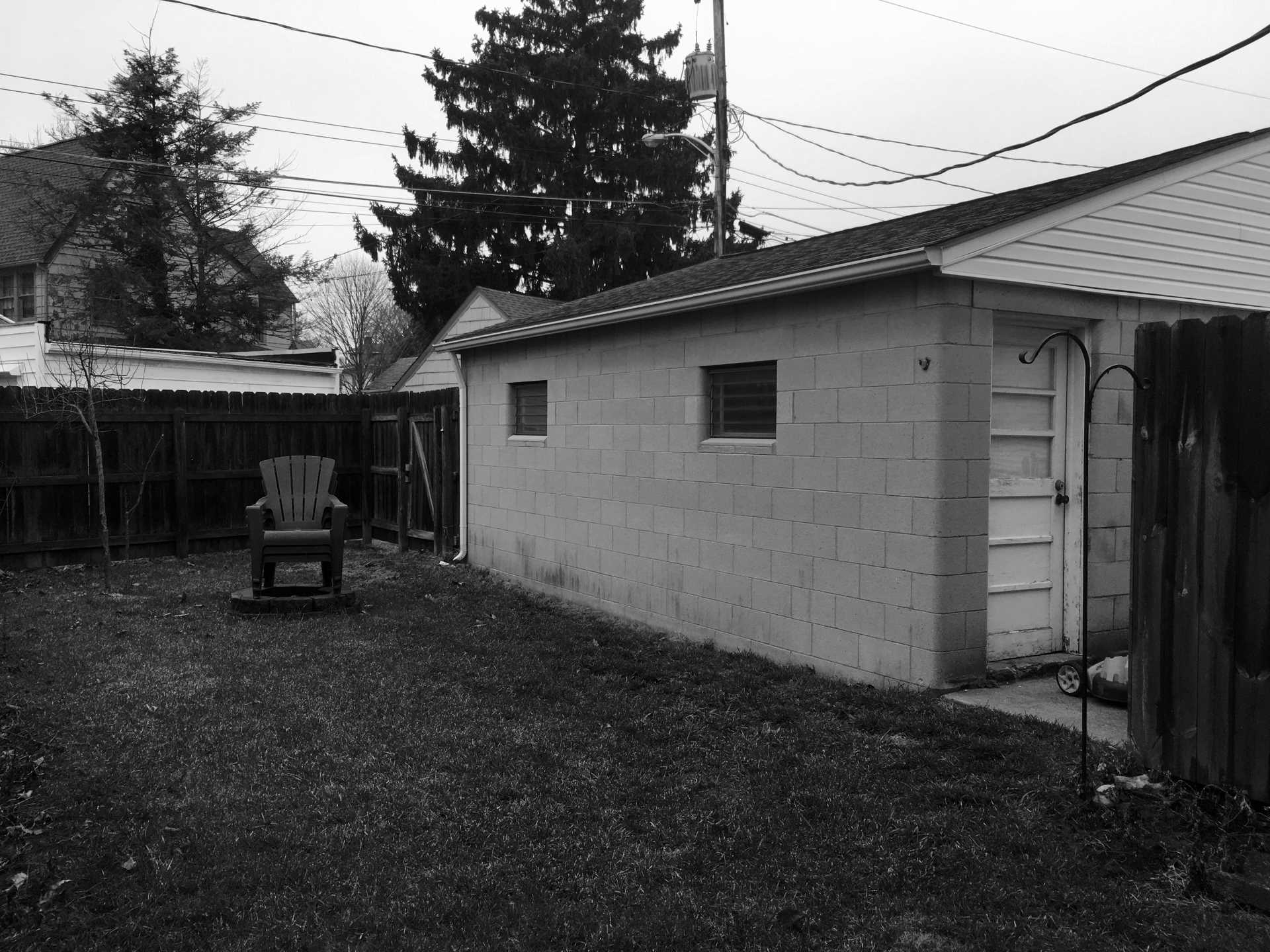 'Before' photo of a small yard.