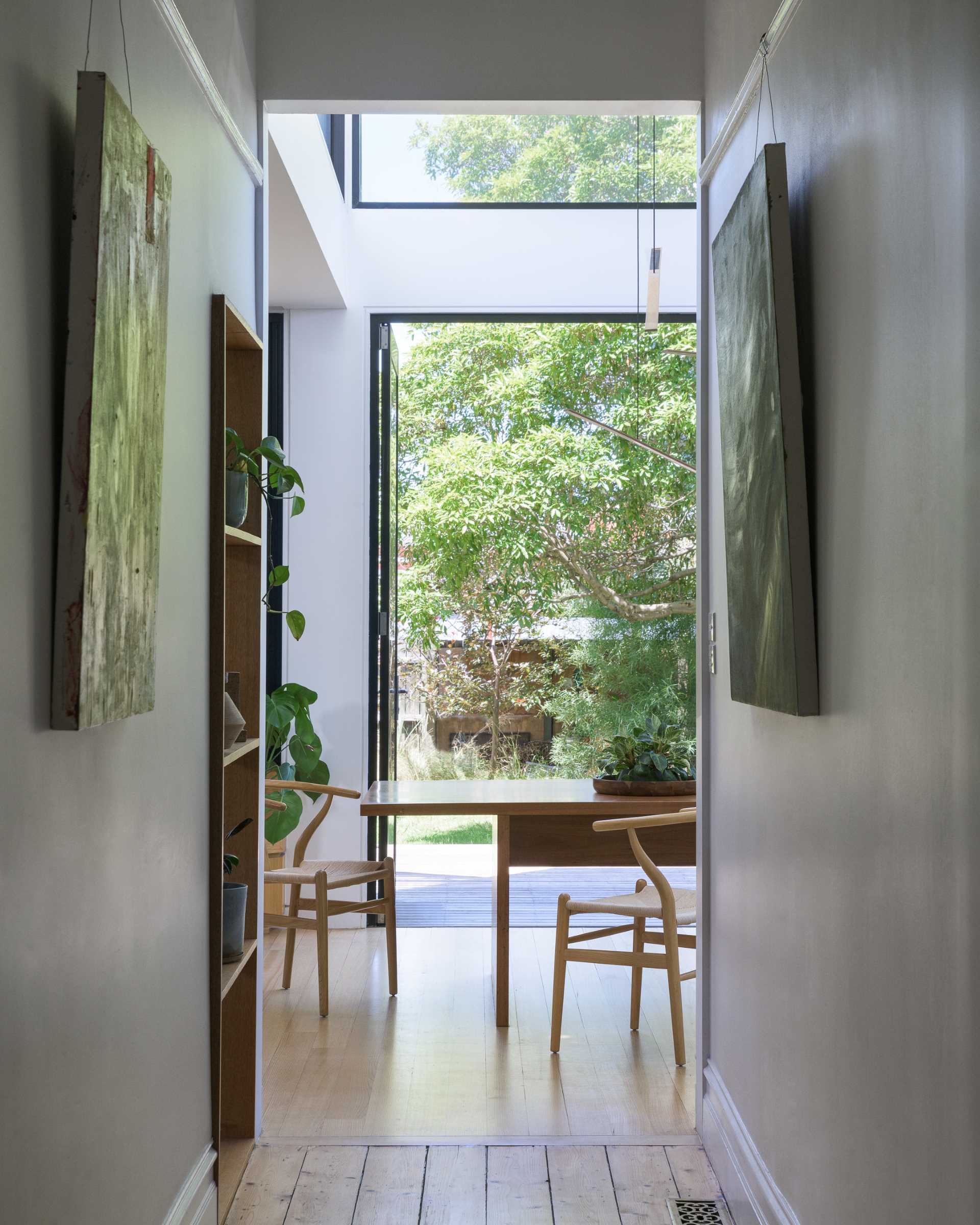 A modern rear extension can be seen from the hallway.