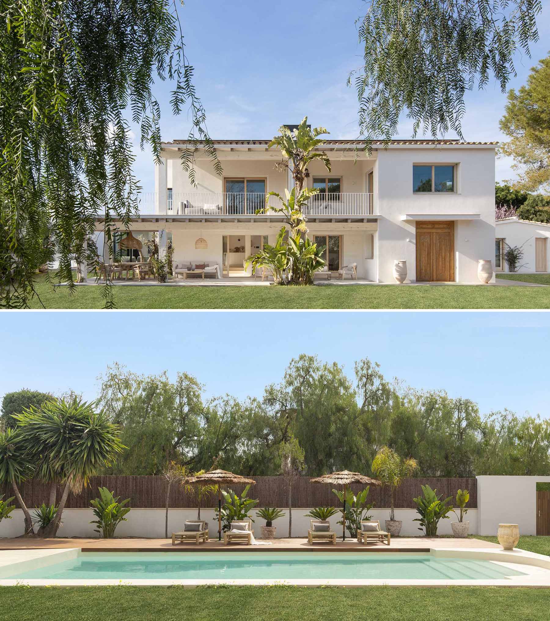 Large windows were integrated into this homes' design so that the surrounding nature and the gardens could be seen from within the home. In the garden, there's a swimming pool and a deck that provides a place for relaxing in the sun.