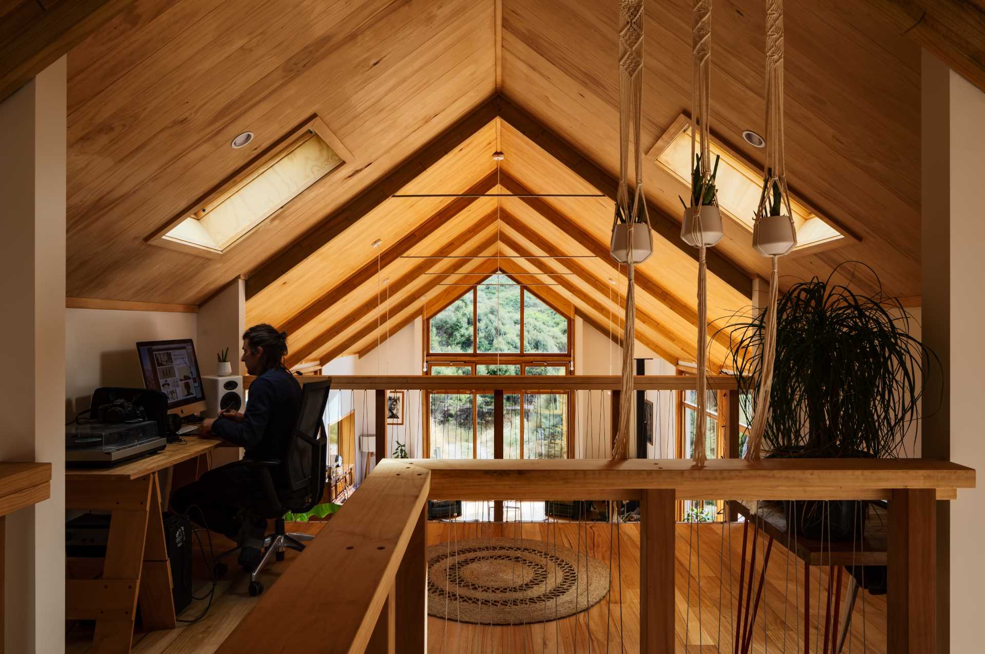 A small loft that's been furnished as a home office.