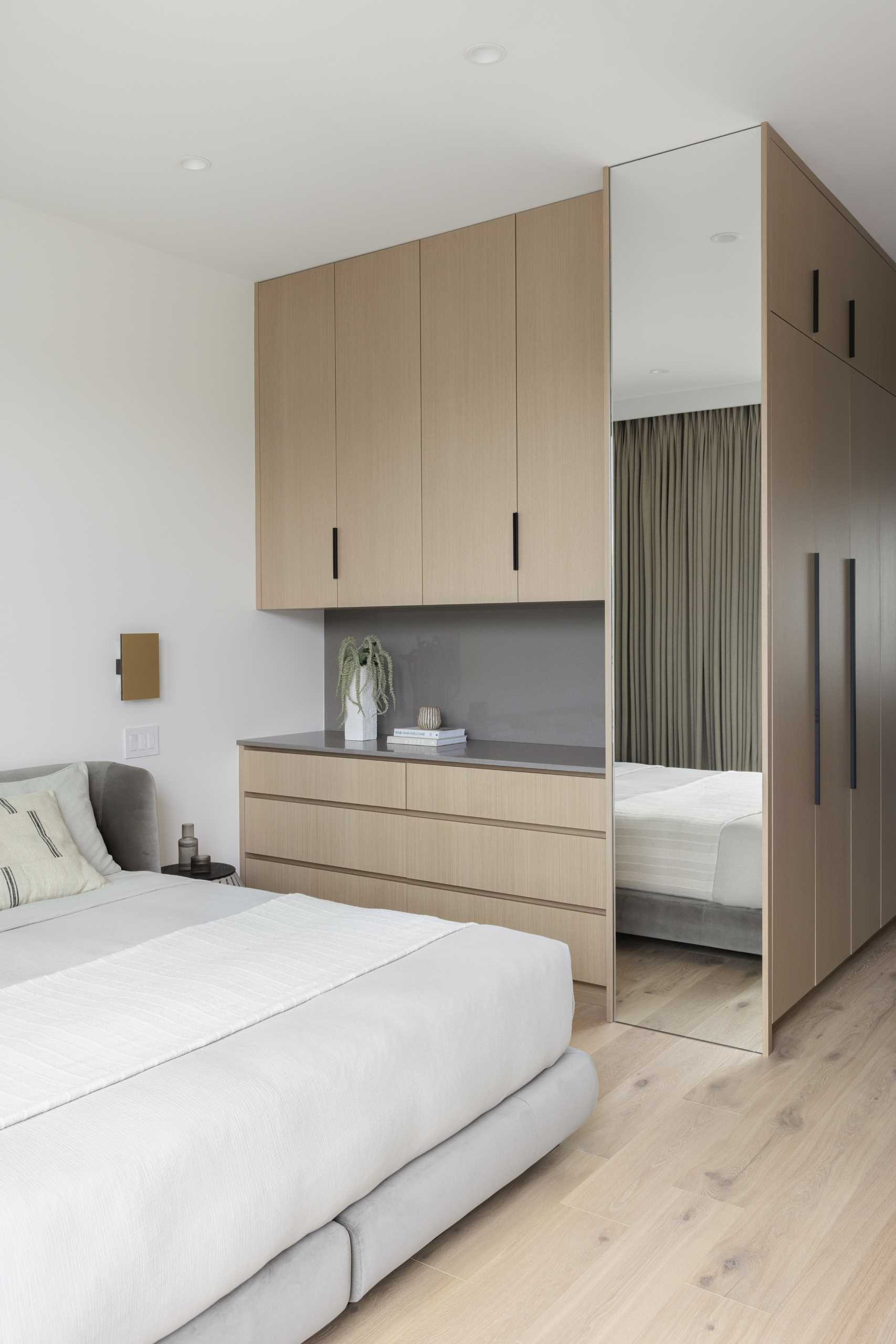 A modern bedroom with custom joinery.