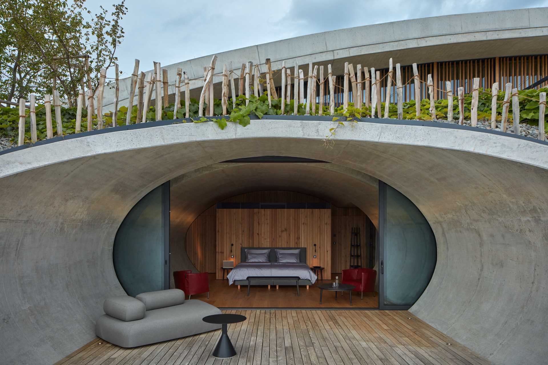 This winery hotel room has its own unique rounded design, with doors that open to a semi-private patio with views of the vineyard.